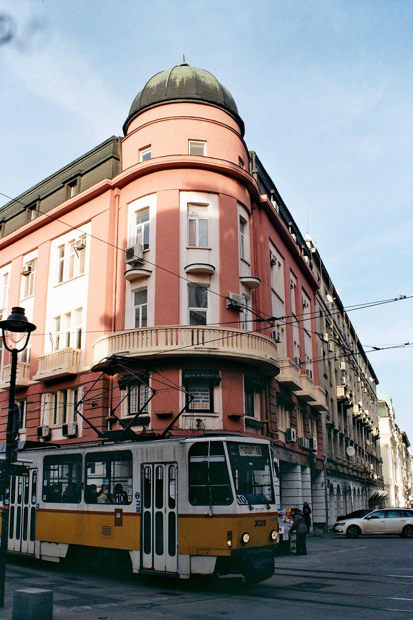 Tram infront of a building