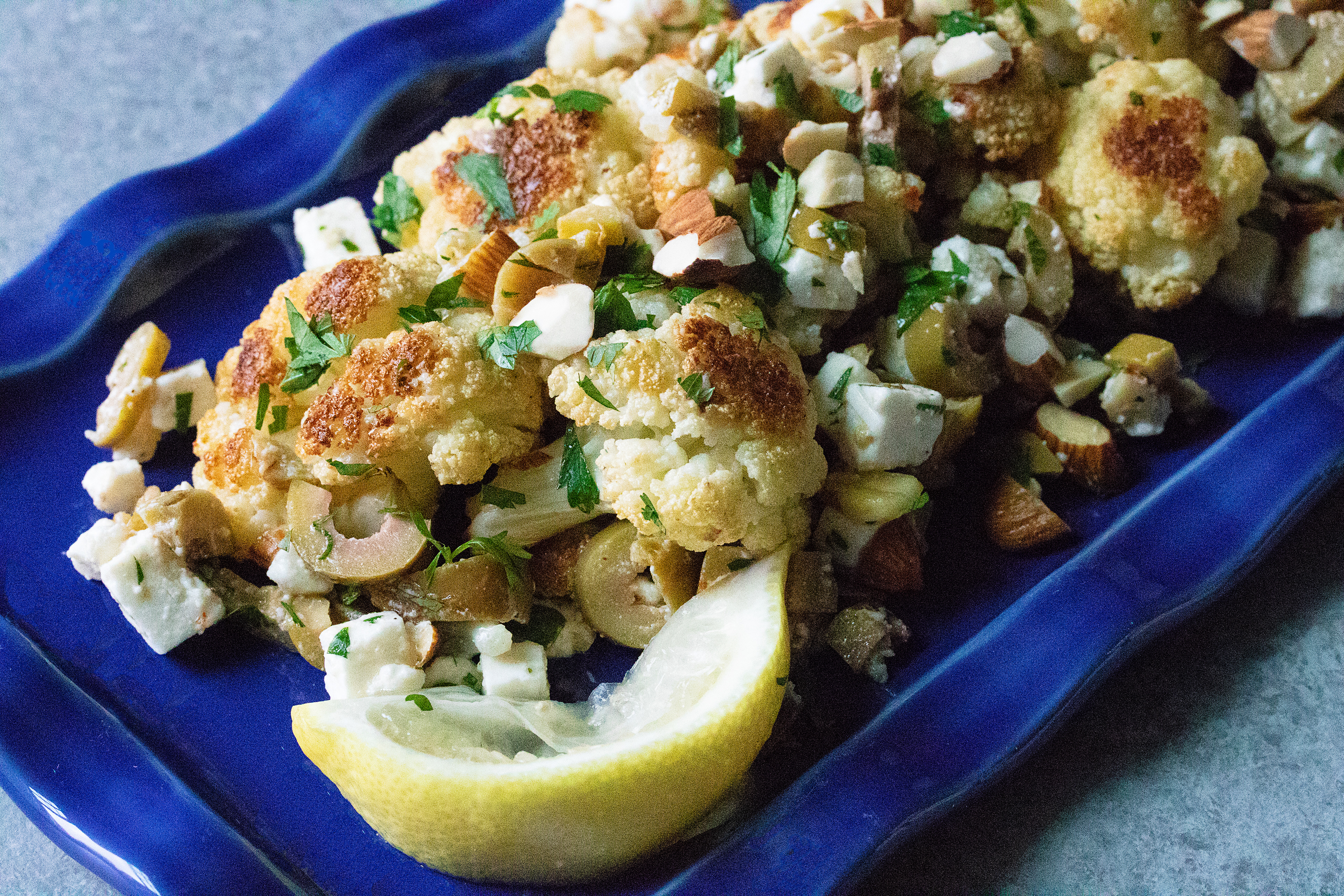 roasted cauliflower with feta, almonds, and green olives