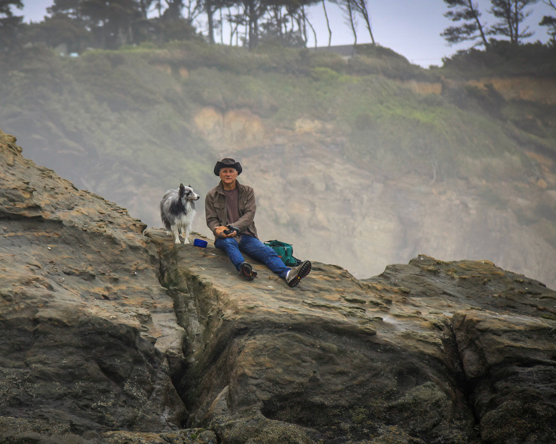 Man and dog enjoying the Oregon Coast