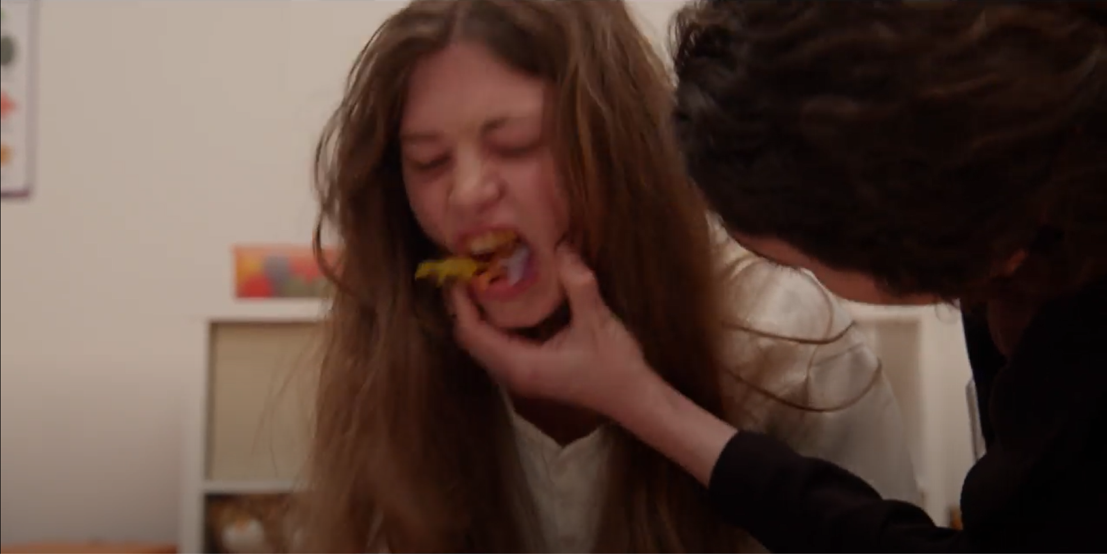 Dr. Amy forces the child to spit out the plastic dinosaurs from her mouth