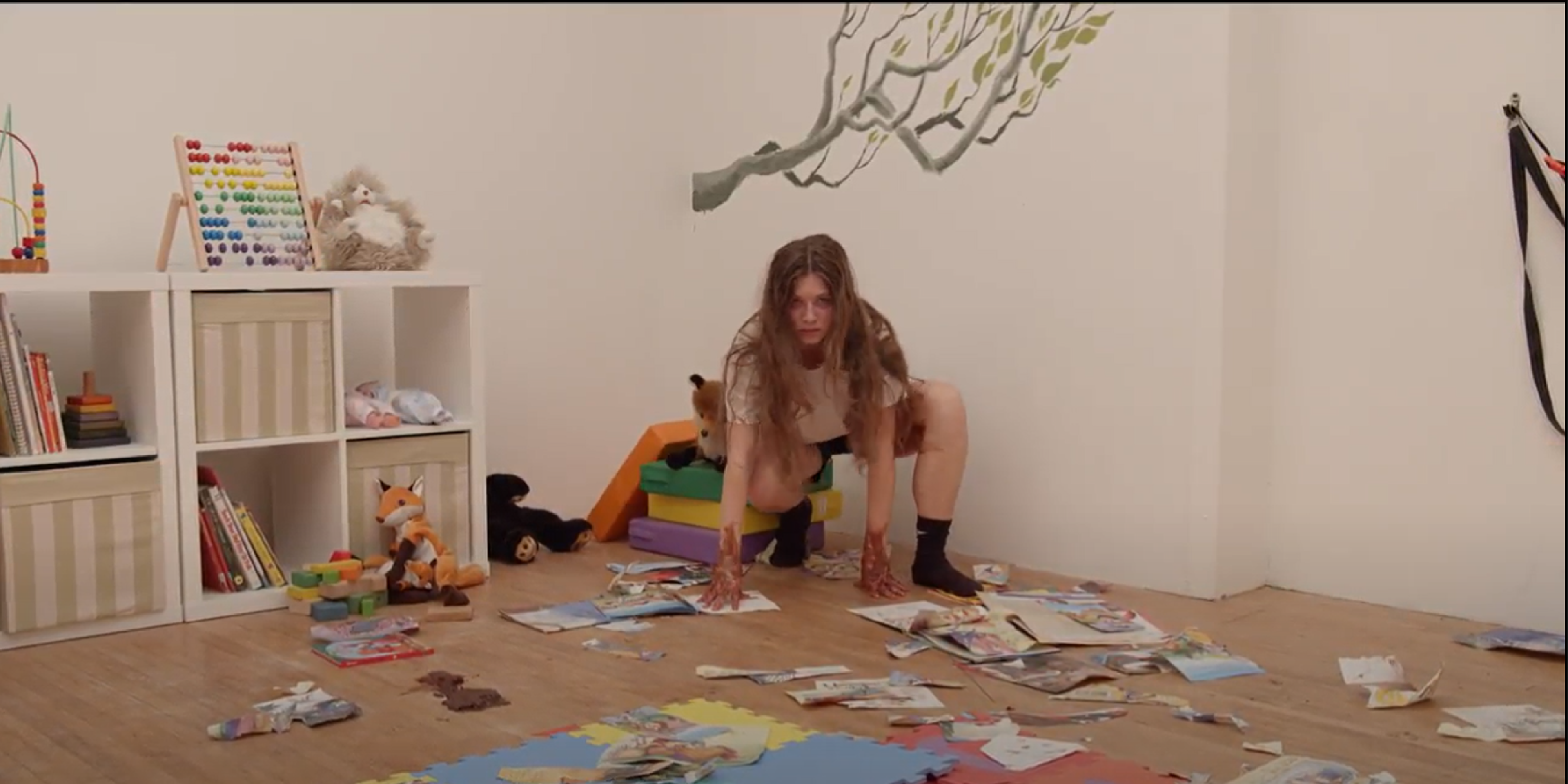 Feral child ripping books, poop on the floor