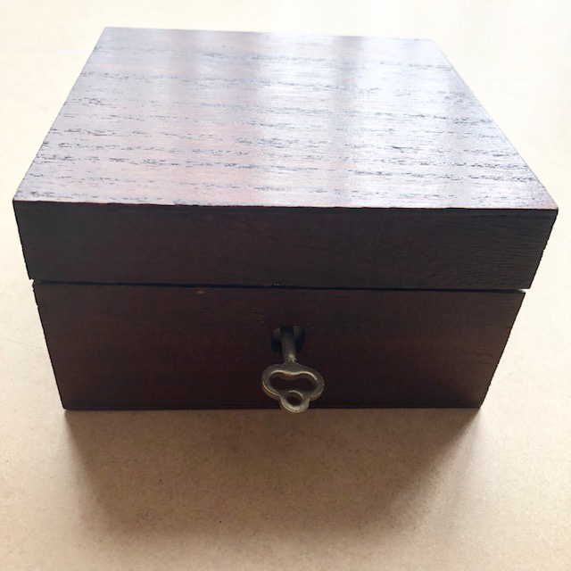 Blank wooden craft box was stained with several coats of Button Polish and a miniature lock and key was added. 