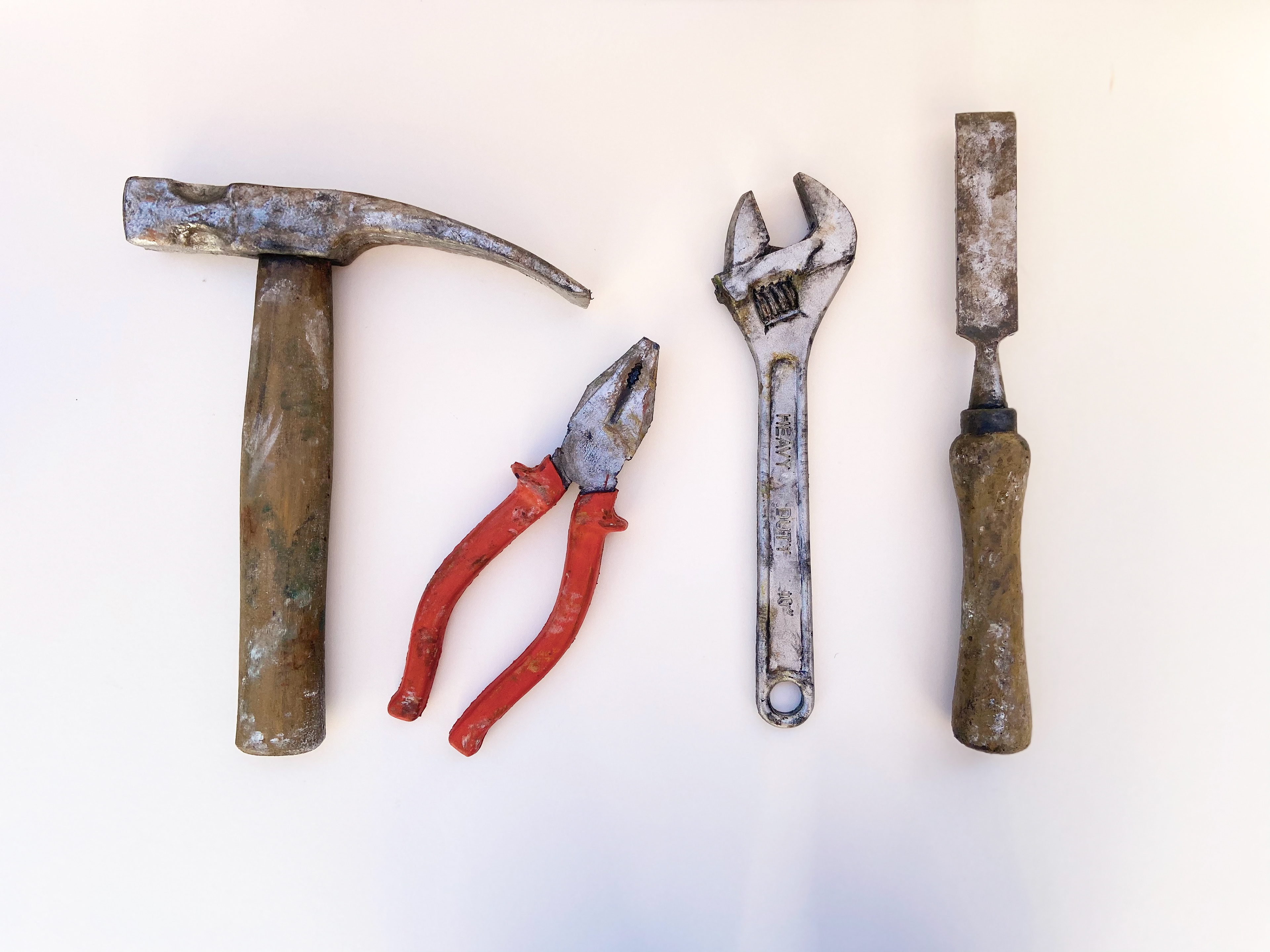 A selection of hand tools cast from Black Gun Foam.  Painted with Acrylic paints mixed with Pros-Aide for flexibility