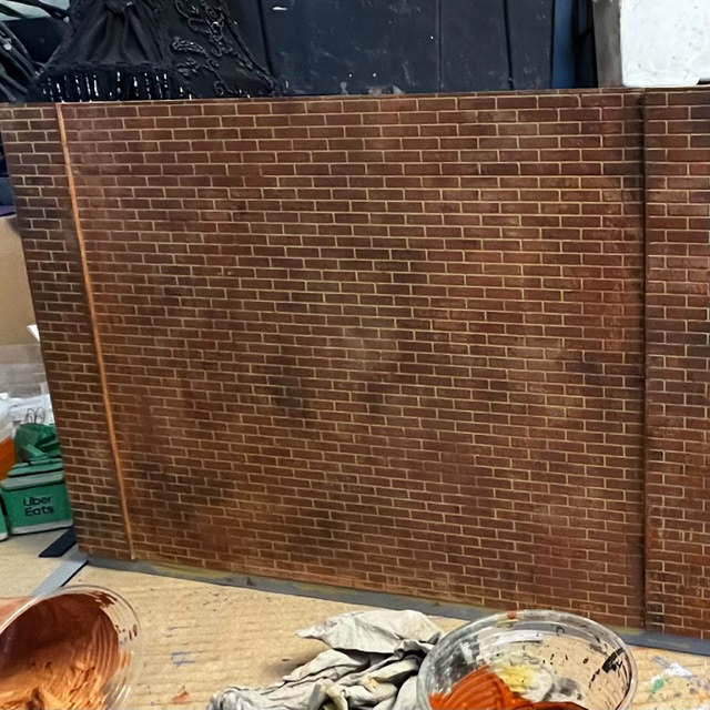 Brick wall painted by myself to match location