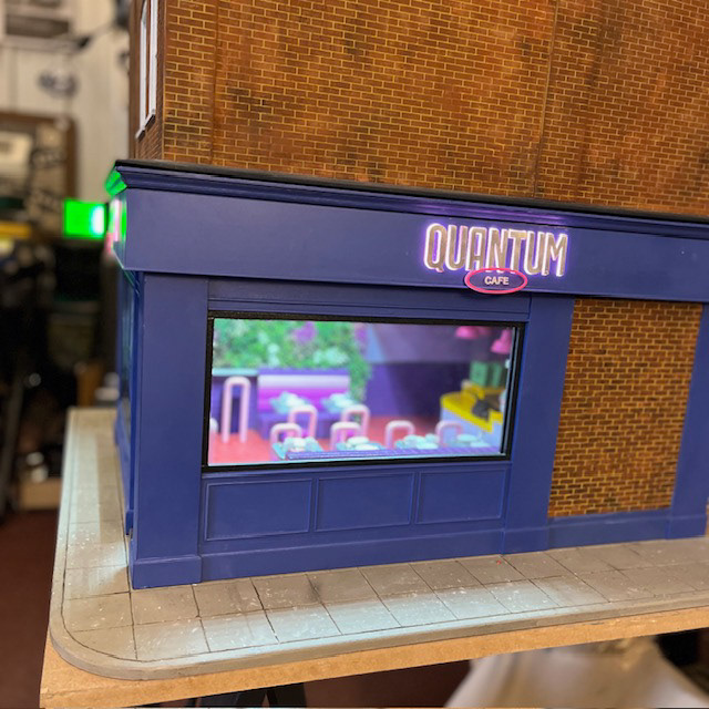 Quantum Cafe I painted with brickwork attached.  Signage letters I covered with silver tape. 