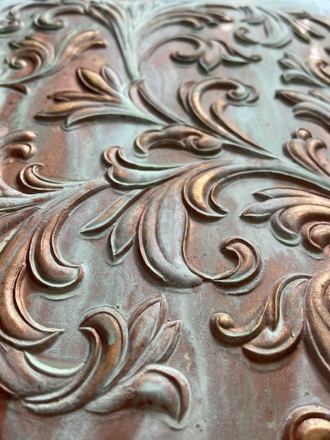 Bronze verdegris sample.  Emulsion paints on heavy embossed wall covering 