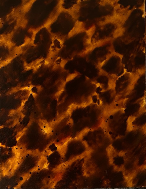 Tortoiseshell effect I painted.  Oil paints with scumble glaze over imitation gold leaf