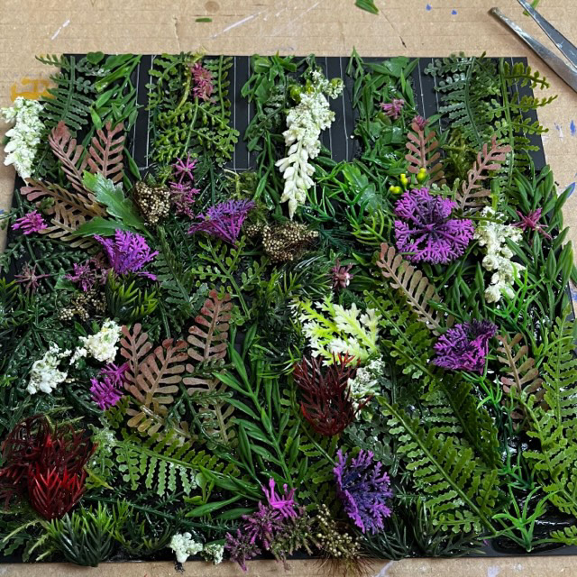Flower wall I created using a mix of artificial flowers and leaves