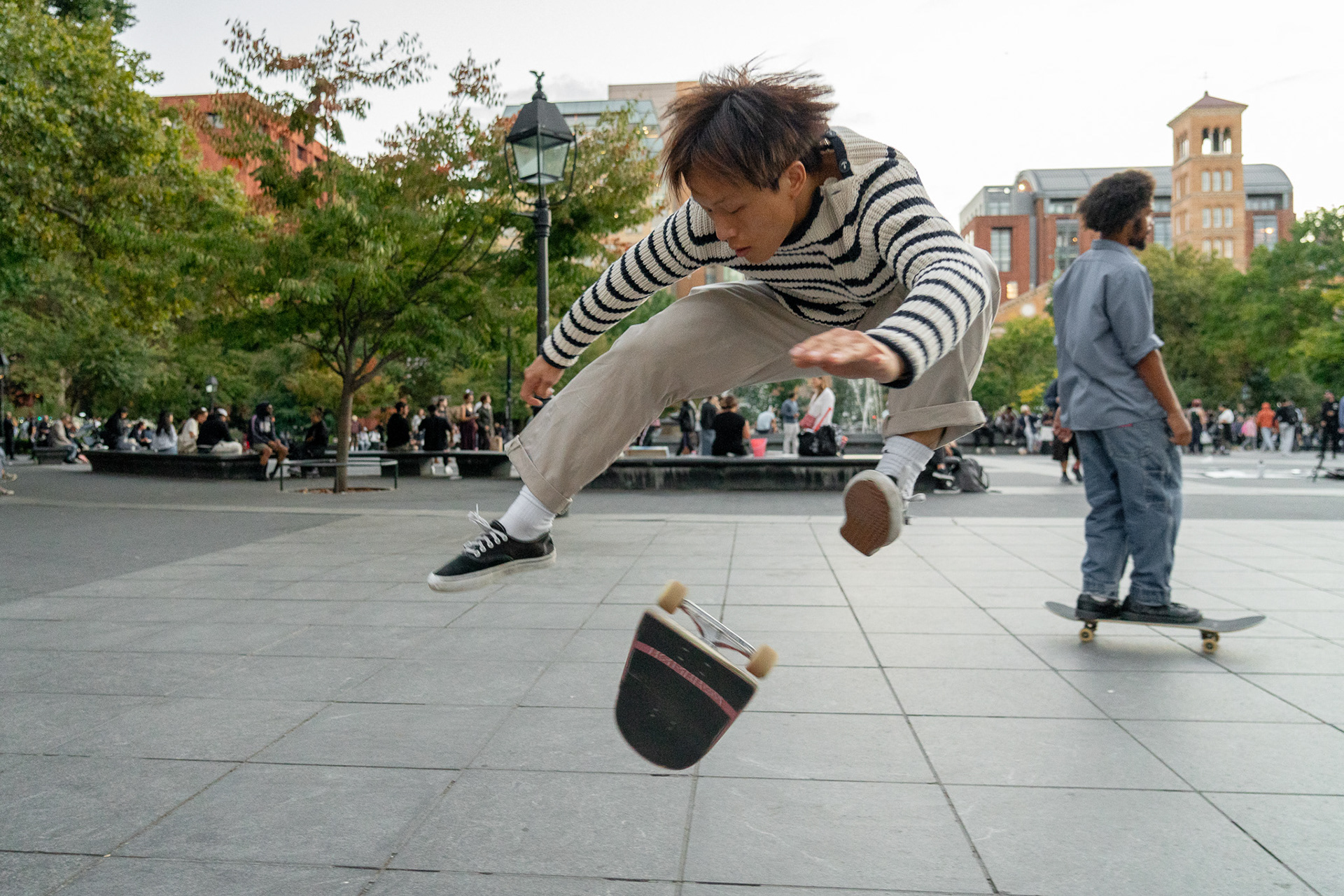 360 Flip performed by Bryan Zen at Wash Sq Park.