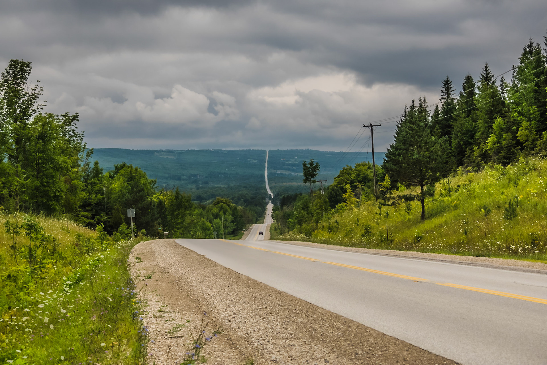 A Grey County sideroad winds through The Blue Mountains, Ontario.