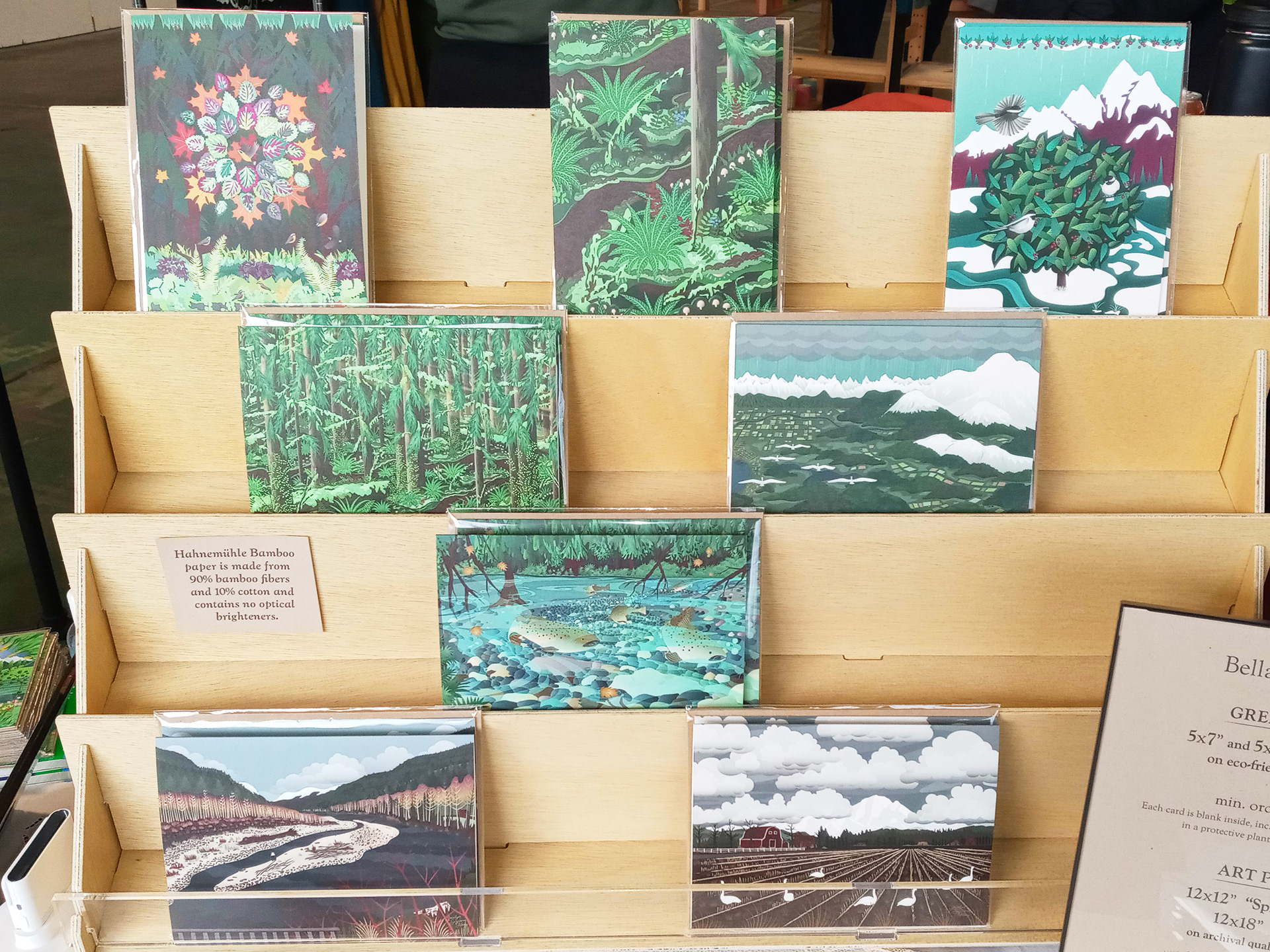 Greeting Card display rack with nature illustrations on cards.