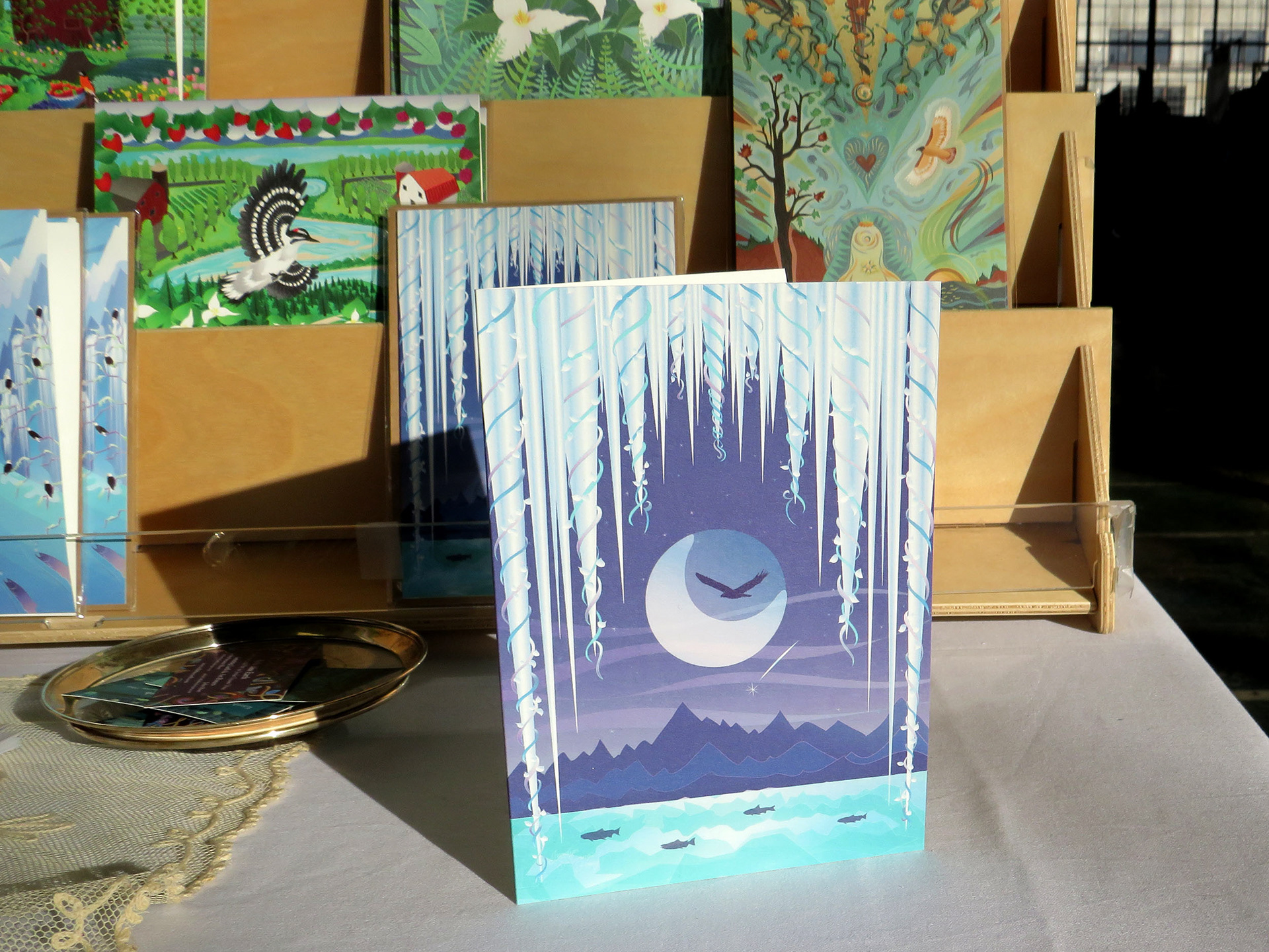 Greeting Card display rack with nature illustrations on cards.