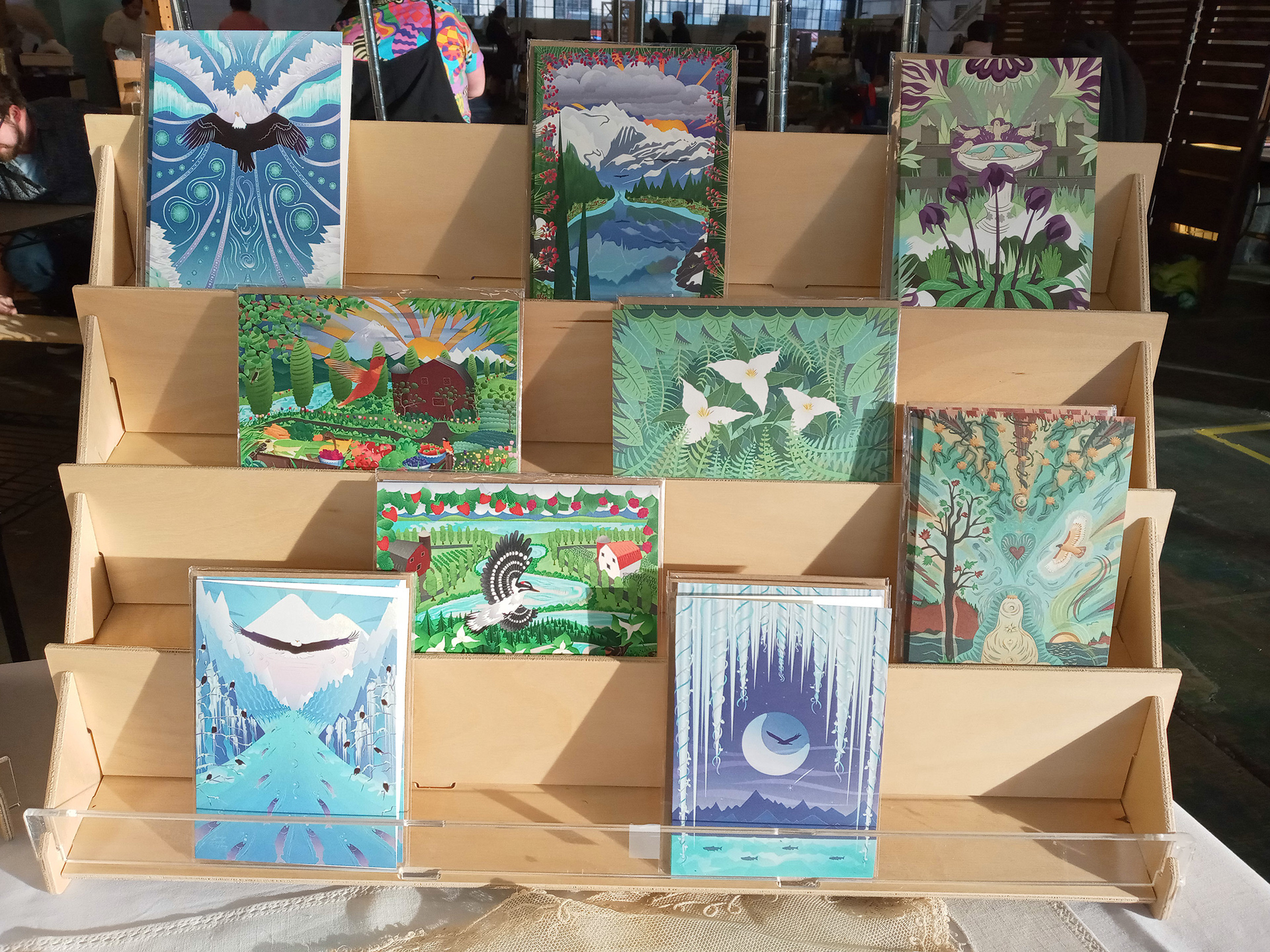 Greeting Card display rack with nature illustrations on cards.