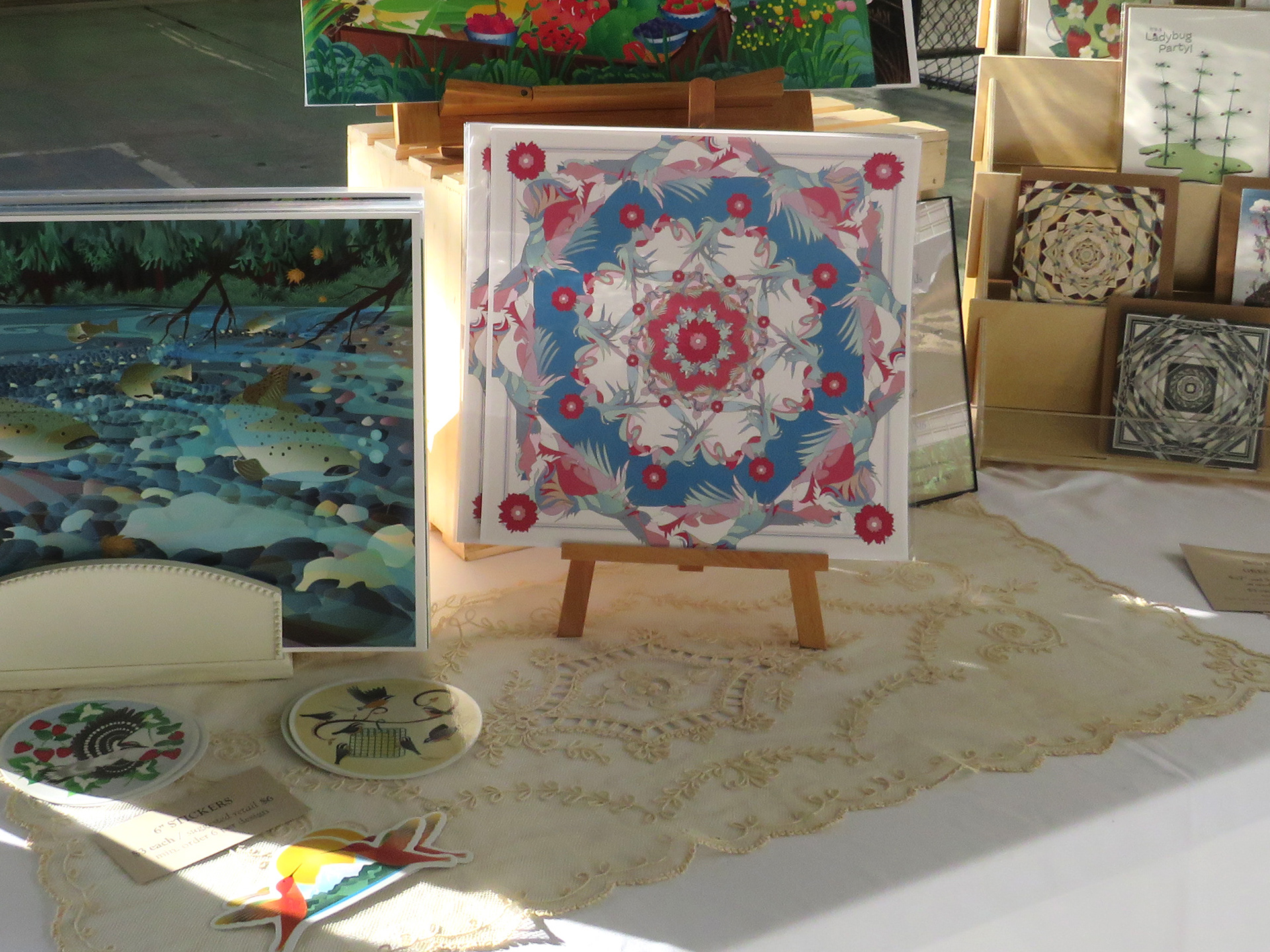 Greeting Card display rack with mandala designs on cards.
