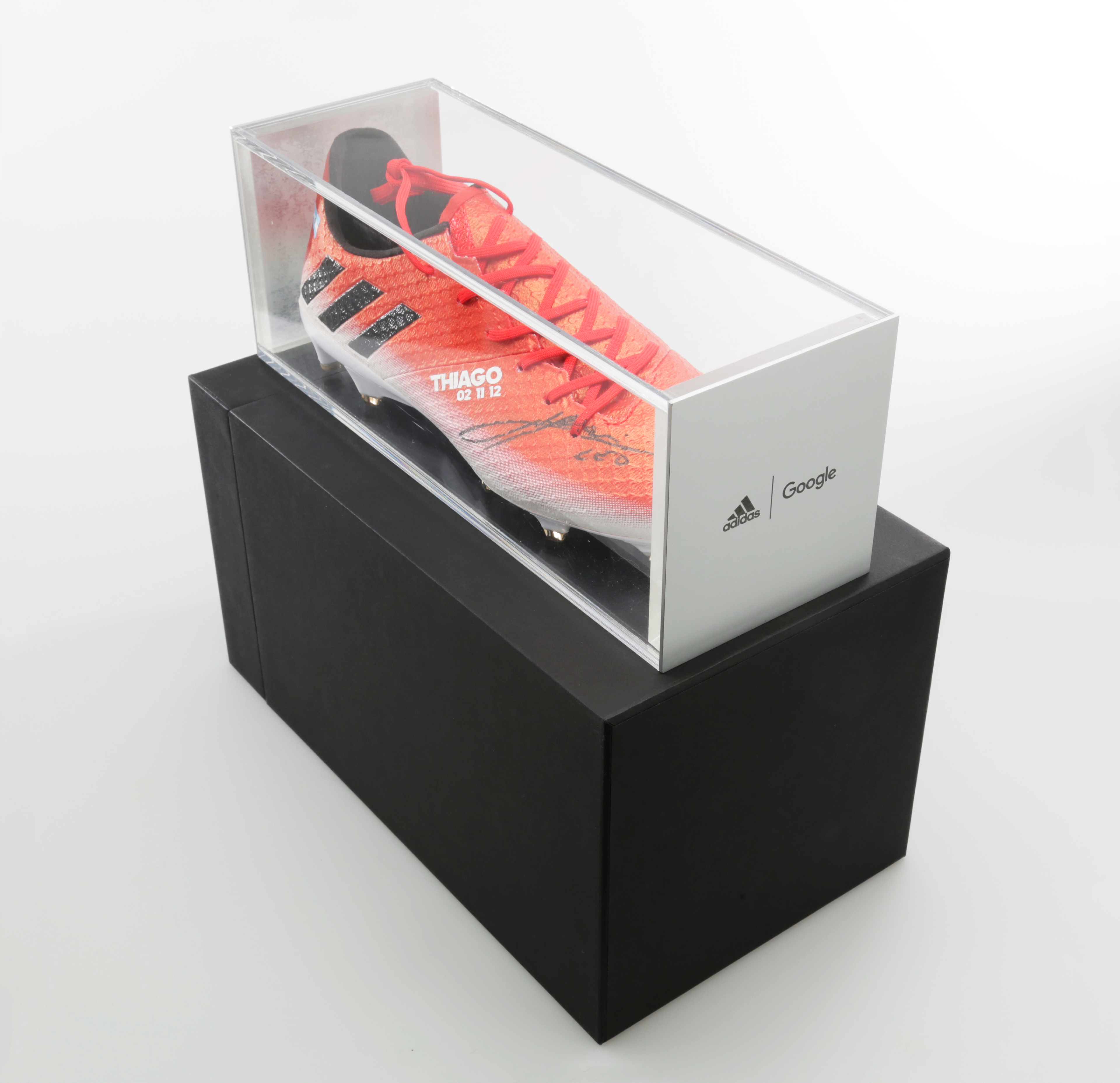 Additional top-down view of display box with shoe housed in acrylic container sitting atop the larger box.