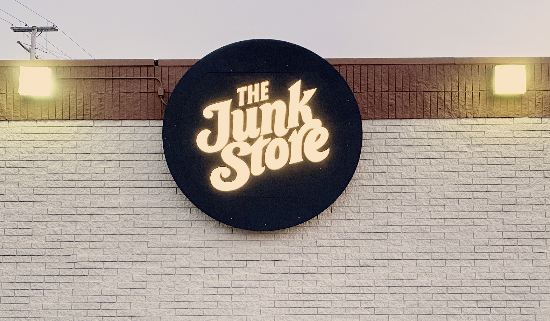 Photograph of large retail sign outside of store.