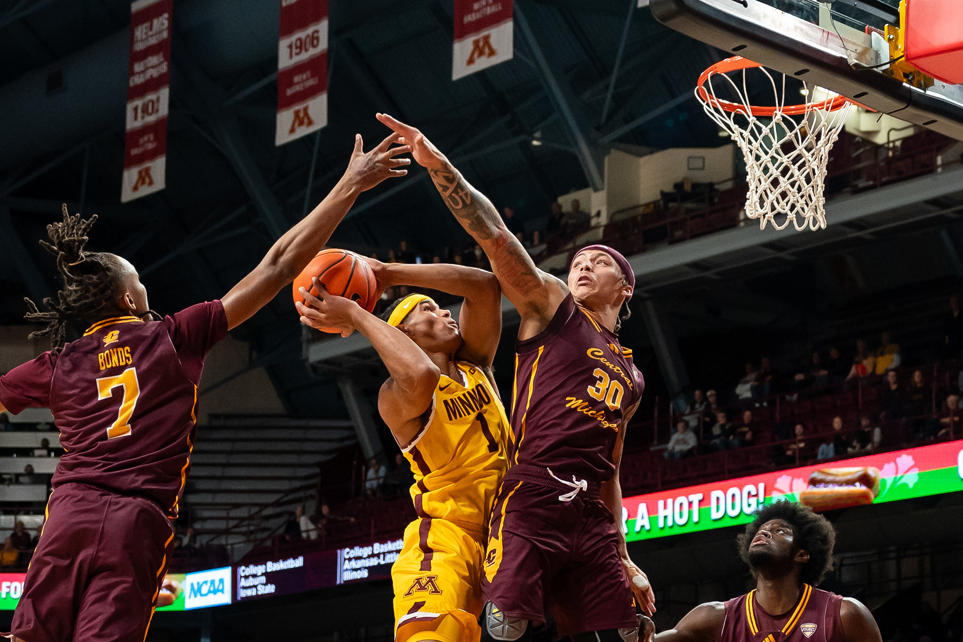 University of Minnesota basketball player Isaac Asuma attempts to throw the ball into the basket during their game against Central Michigan University on Nov. 25, 2024. Minnesota claimed the victory against Central Michigan with a score resulting in 68-65.