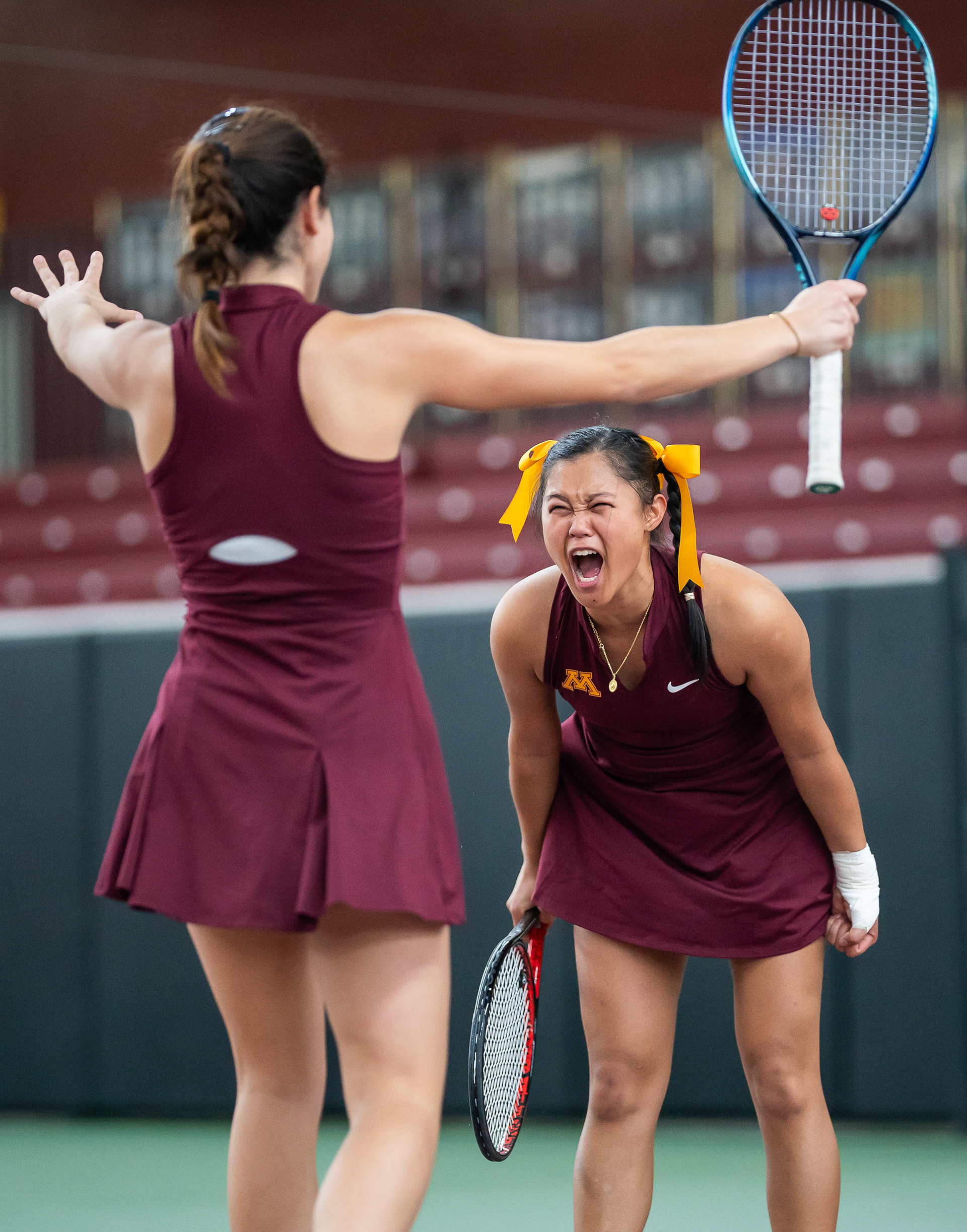 University of Minnesota athletes Jeselle Ante (right) and Sofia Pinto (left) celebrates a doubles match win against Rutgers at the Tennis Baseline Center in Minneapolis, Minn. on March 28, 2025. The result of the match was 7-5 with a Minnesota victory.