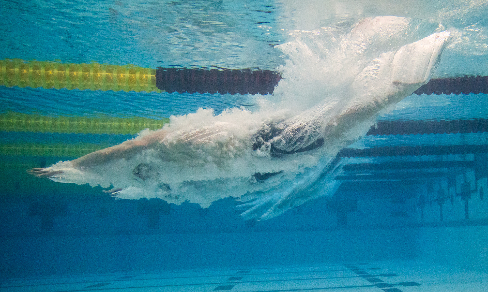 Luke Brennan enters the swimming pool at the start of the Men’s 500 Yard Freestyle race in Jean K. Freeman Aquatic Center in Minneapolis, Minn. on Jan. 31, 2025. Brennan placed third in the race.