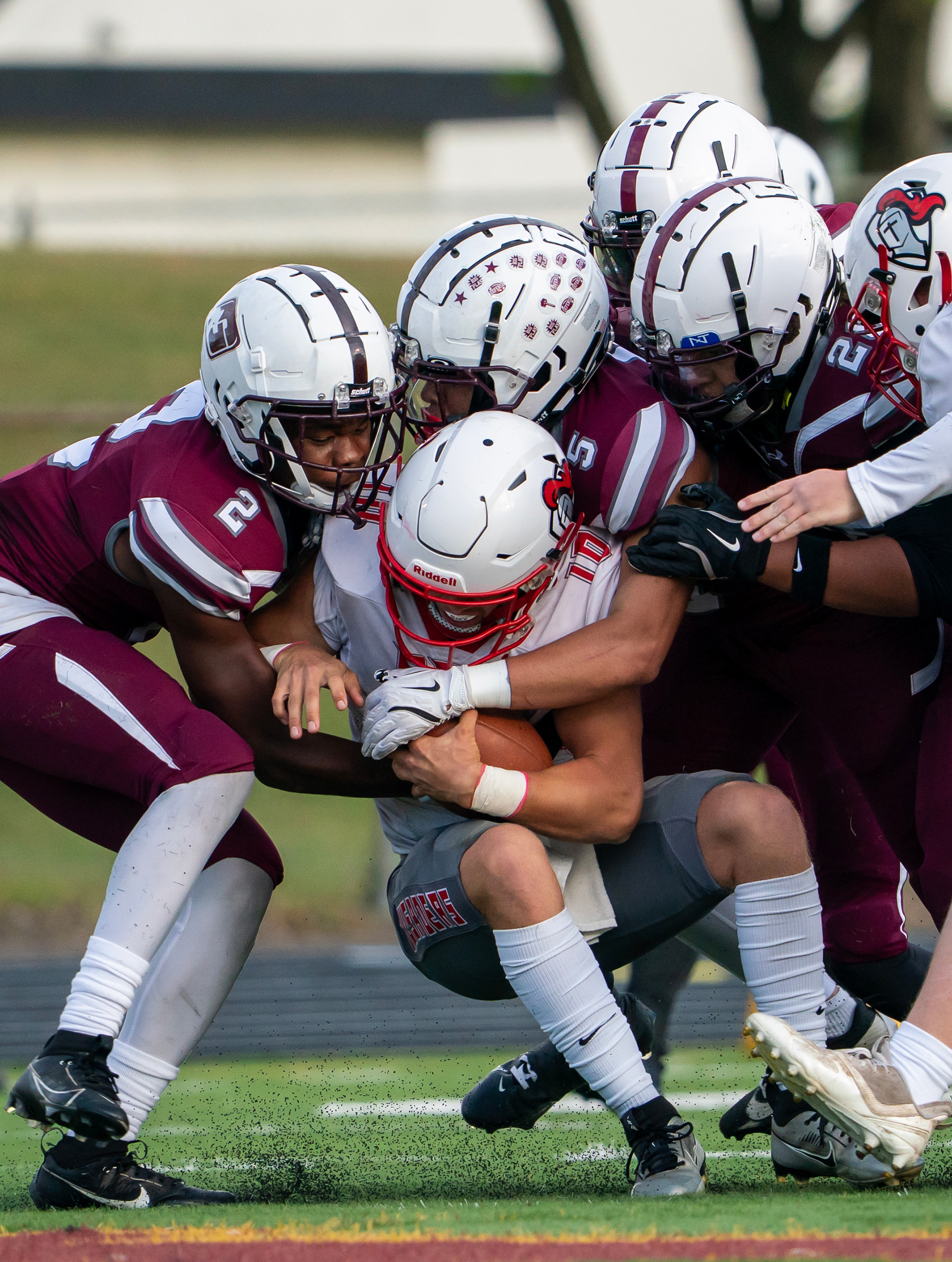 St. Paul Johnson football players tackle St. Croix Lutheran’s  quarterback Villiam Andersen (10) at Harding High School in St. Paul on Friday, Sept. 5, 2025.
