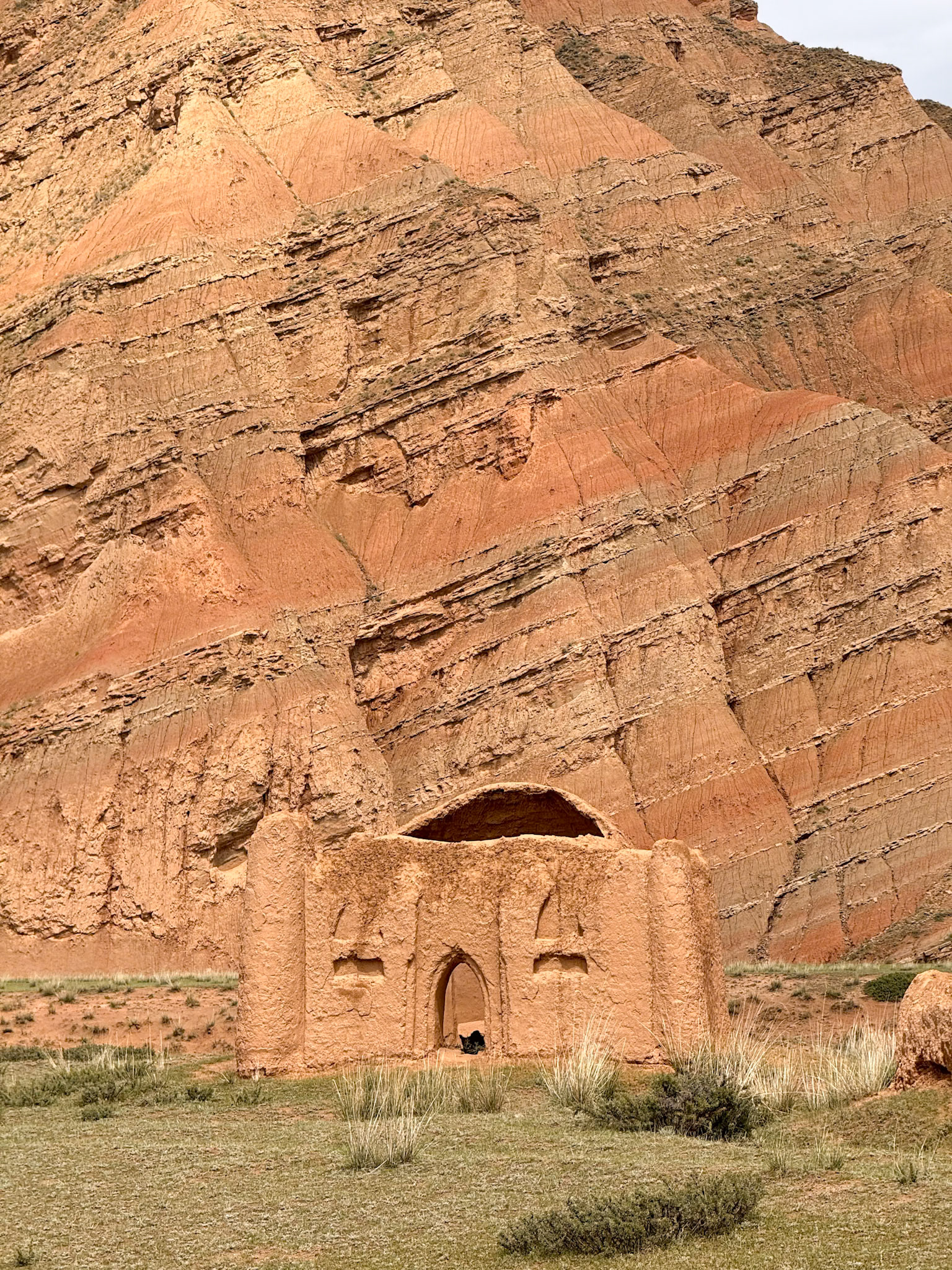 A mausoleum, seamlessly blending into its surroundings