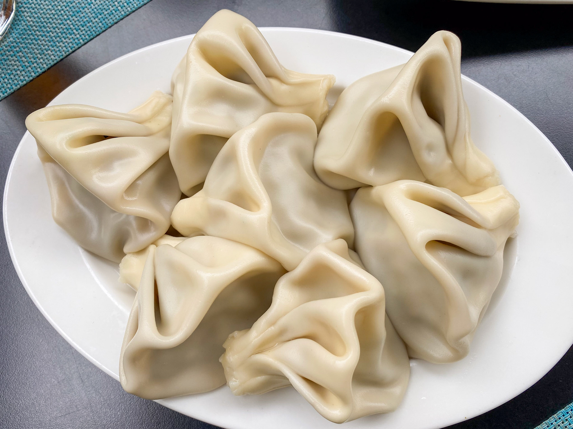 Khinkali is another iconic Georgian food. It resembles the soup dumplings you can find in China but they aren’t the same, thanks to the distinctive use of Georgian spices. Khinkali are artfully twisted knobs of dough stuffed with spices and lamb, pork or beef. They are served boiled or steamed. When the dumpling is cooked, the meat juices are trapped within.