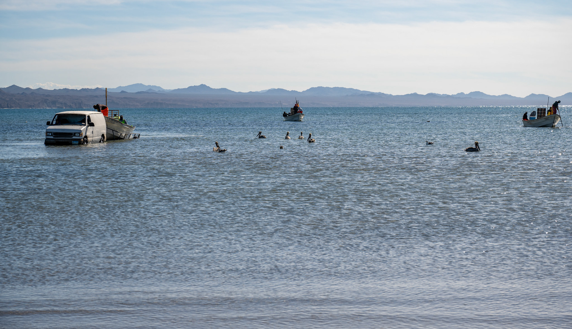 The ballet of this van taking boats in and out of the water is fascinating! Crazy that it drives 80-100 m from the shore.