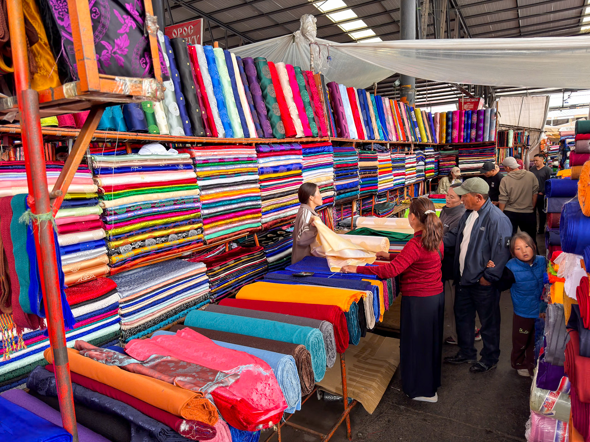 The number of "stores" is mind blowing! It's organized by section so there will be for example dozen of people selling fabrics in the same area