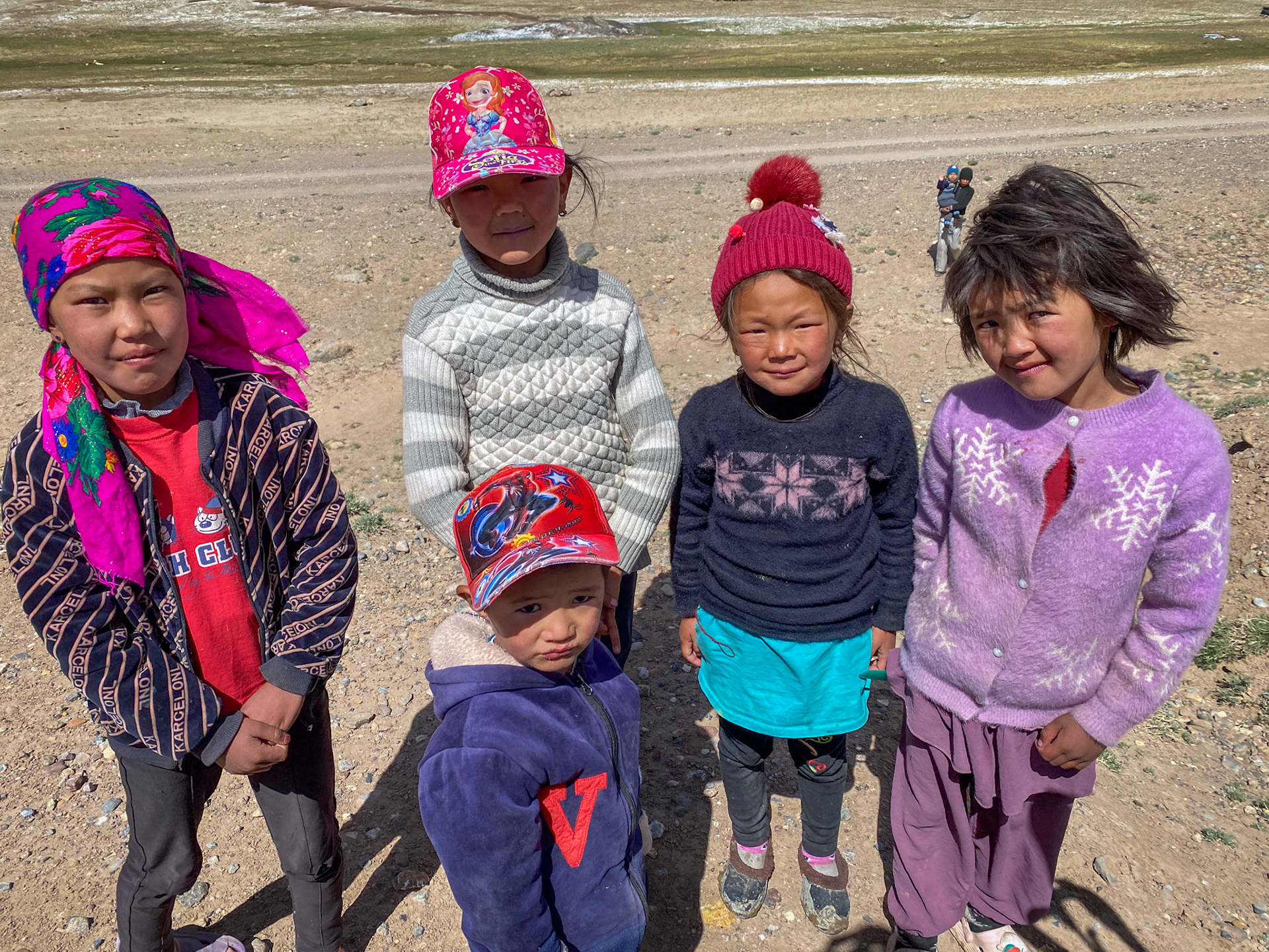 The kids from these yurts run to meet us. I so wished I had some goodies to give them