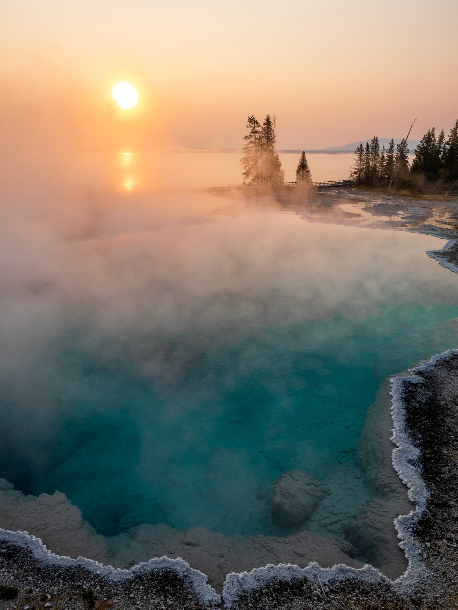 Geyser pool in front of Yellowstone Lake, and the magic of early morning