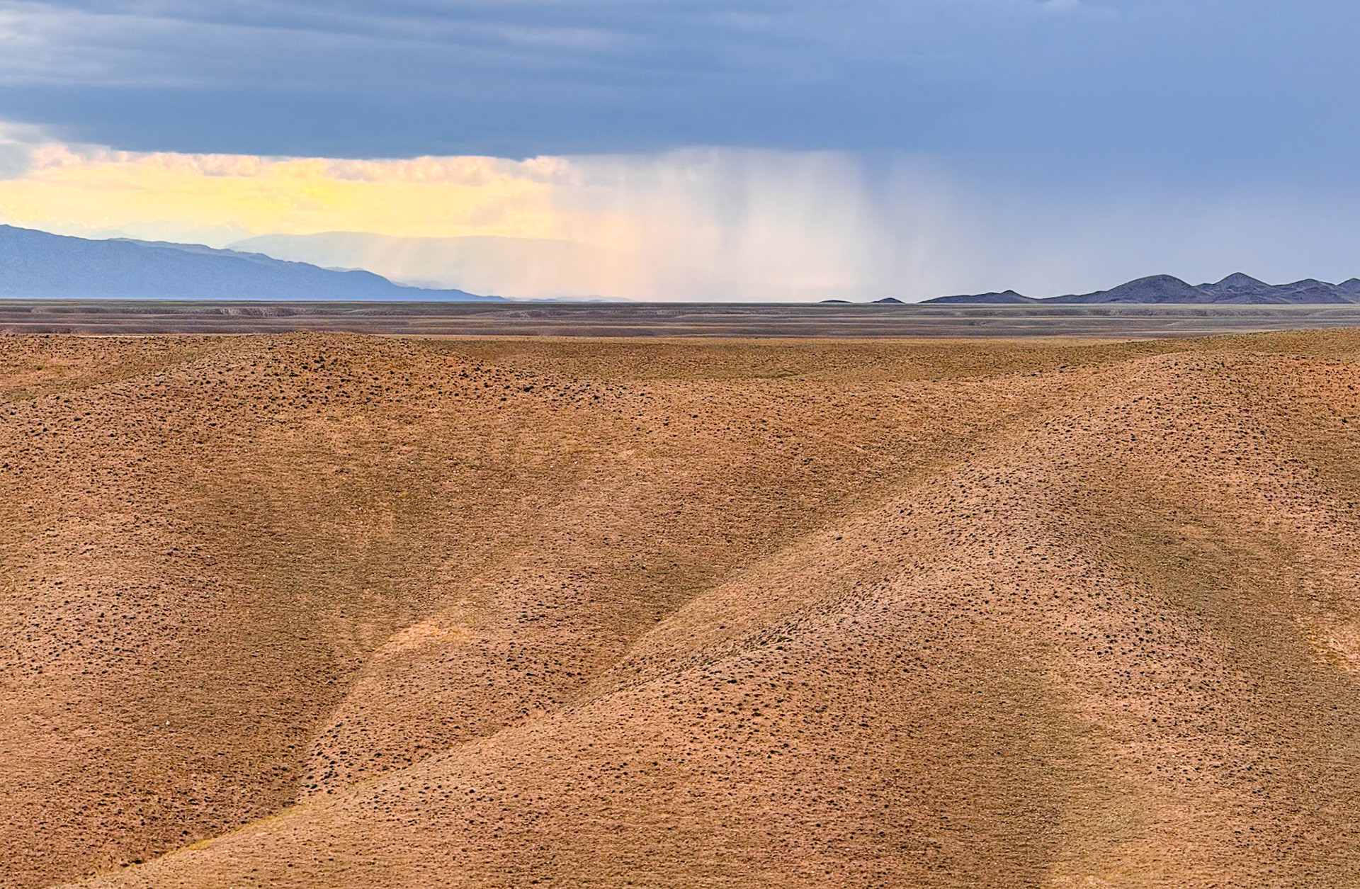 Watching the rain clouds do their business. They were nice enough to avoid us, but not by far.