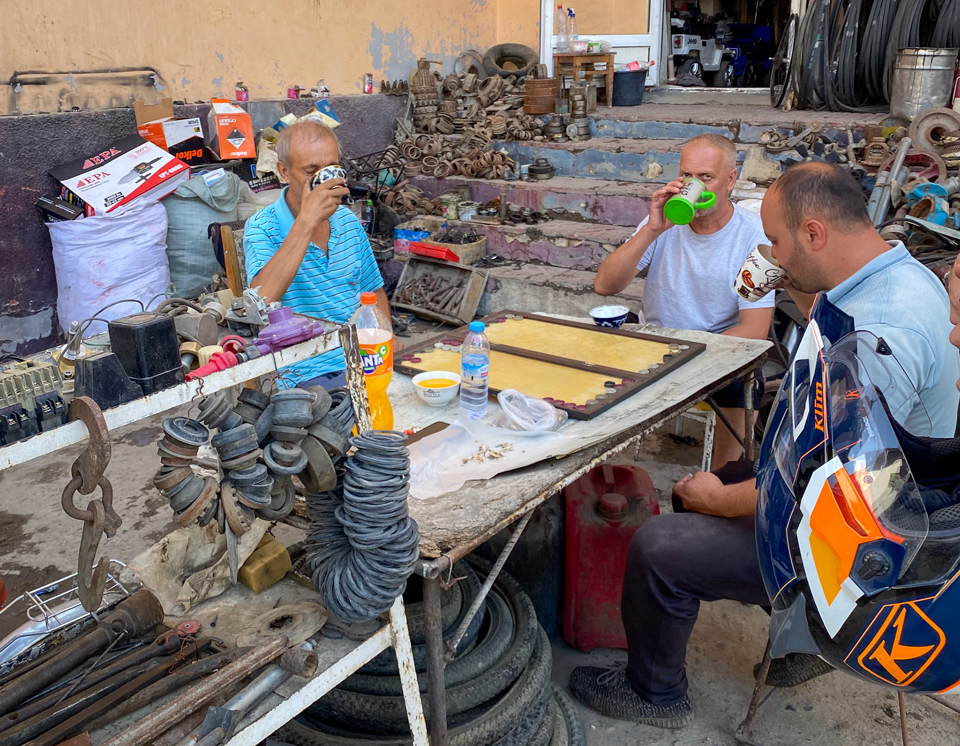 Do you think that we'll find good motorcycle oil there? No, but we found an invitation to share their vodka!