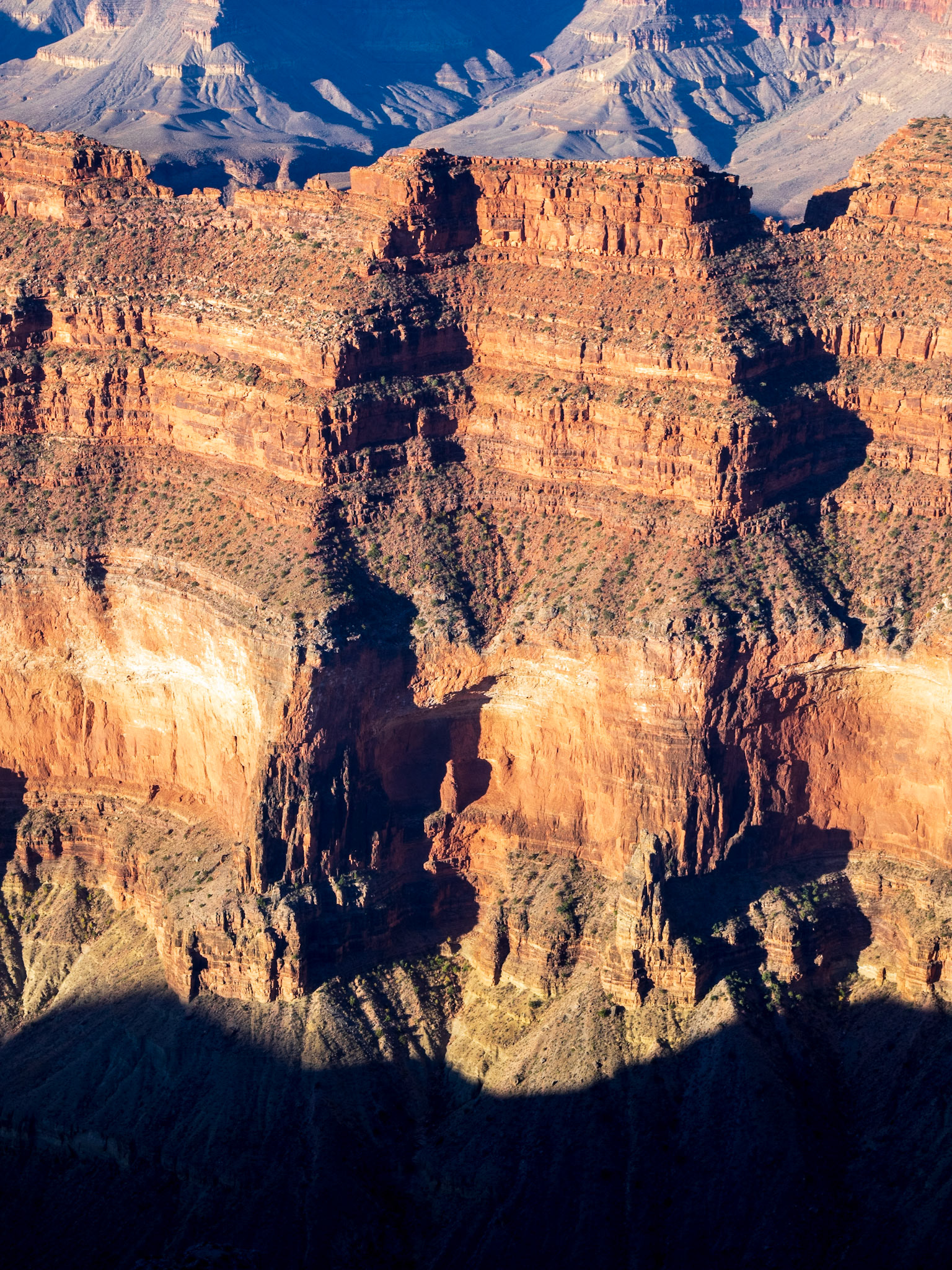 Light plays with our imagination: is it the statue of a sentinel in the middle of that cliff?
