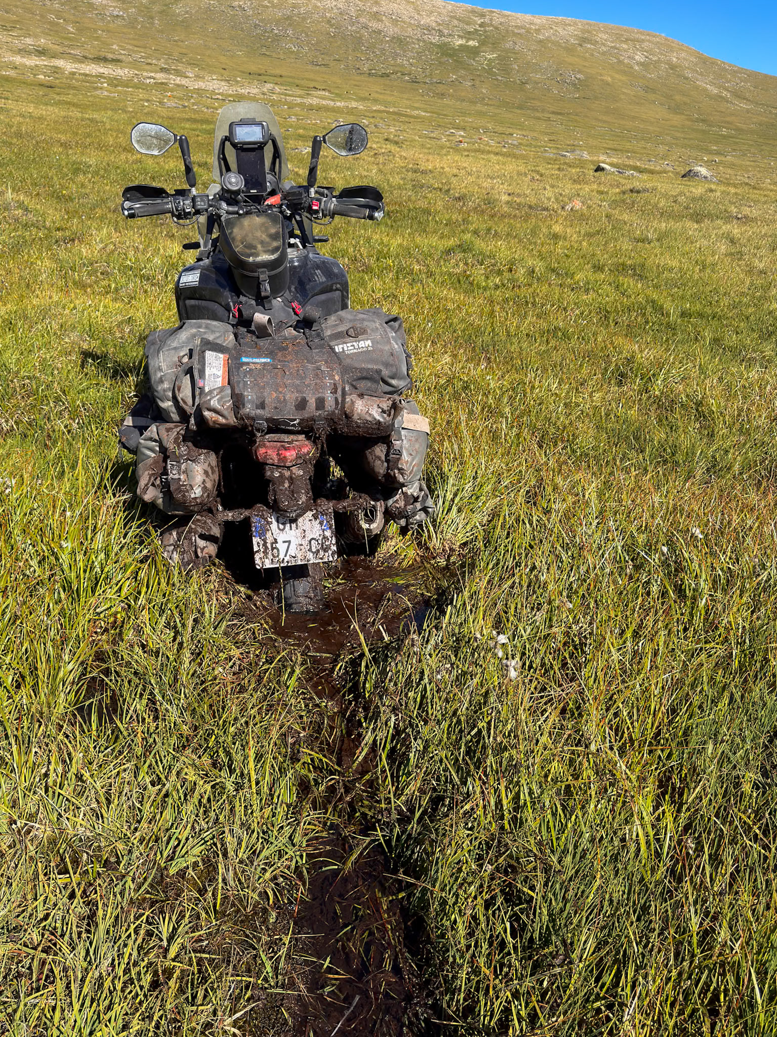 It's like a river underneath that grass and it took a huge amount of efforts to get the bike out. Push from behind at your own risk!