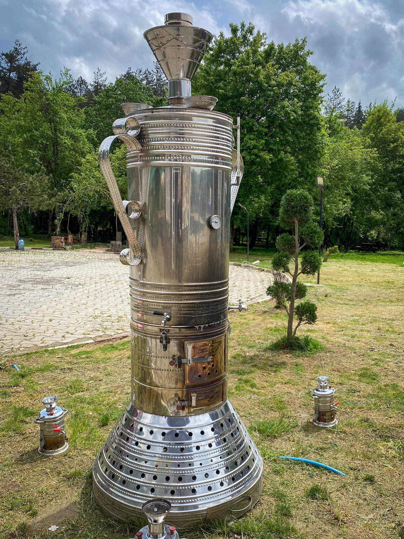 Giant samovar with normal sized ones around. Used to make the ubiquitous Chai or tea here.