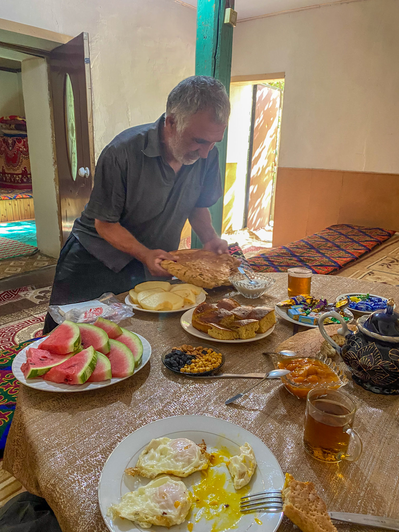 Our kind host giving us more delicious home bread (from the ceremony) for our breakfast