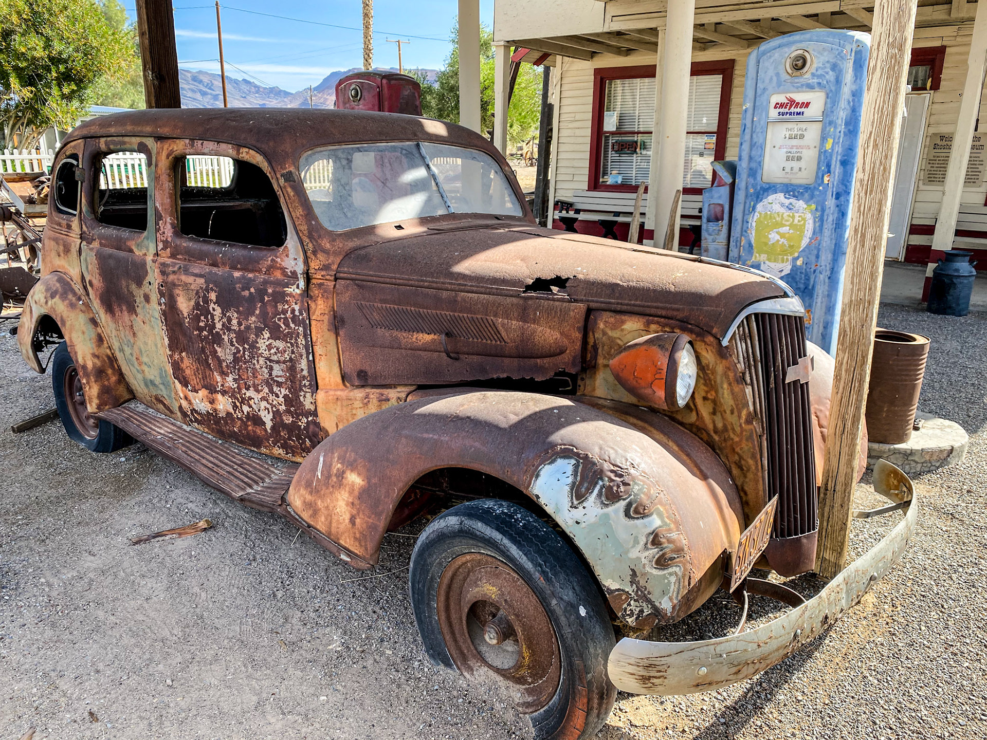 Old Chevy in an abandoned gas station in Shoshone
