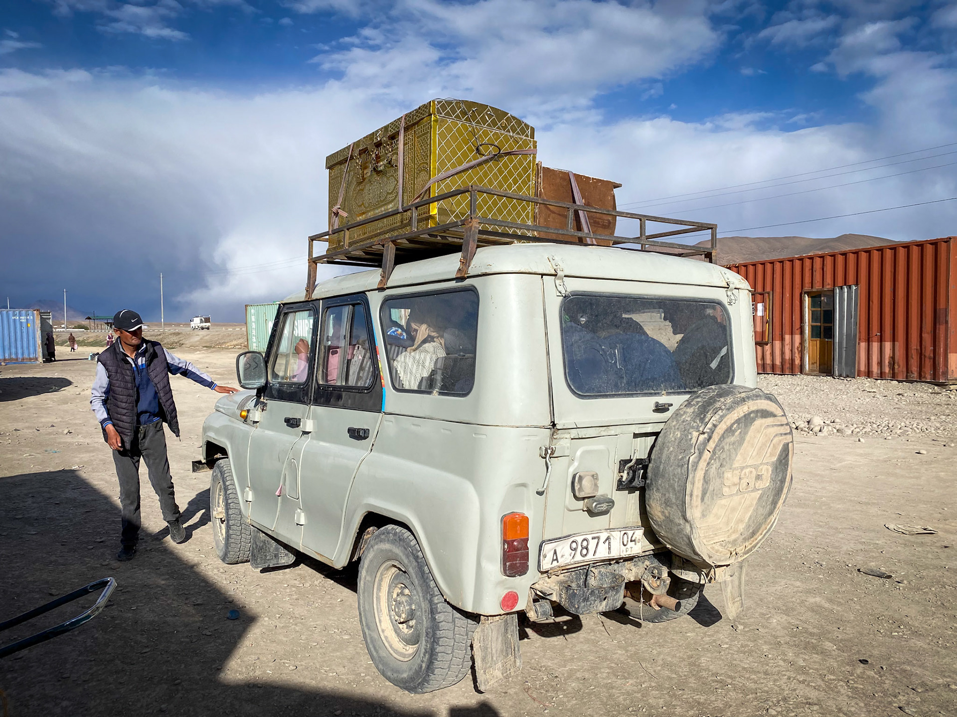 I love the malle on the roof and how many people were able to fit into this old Russian jeep