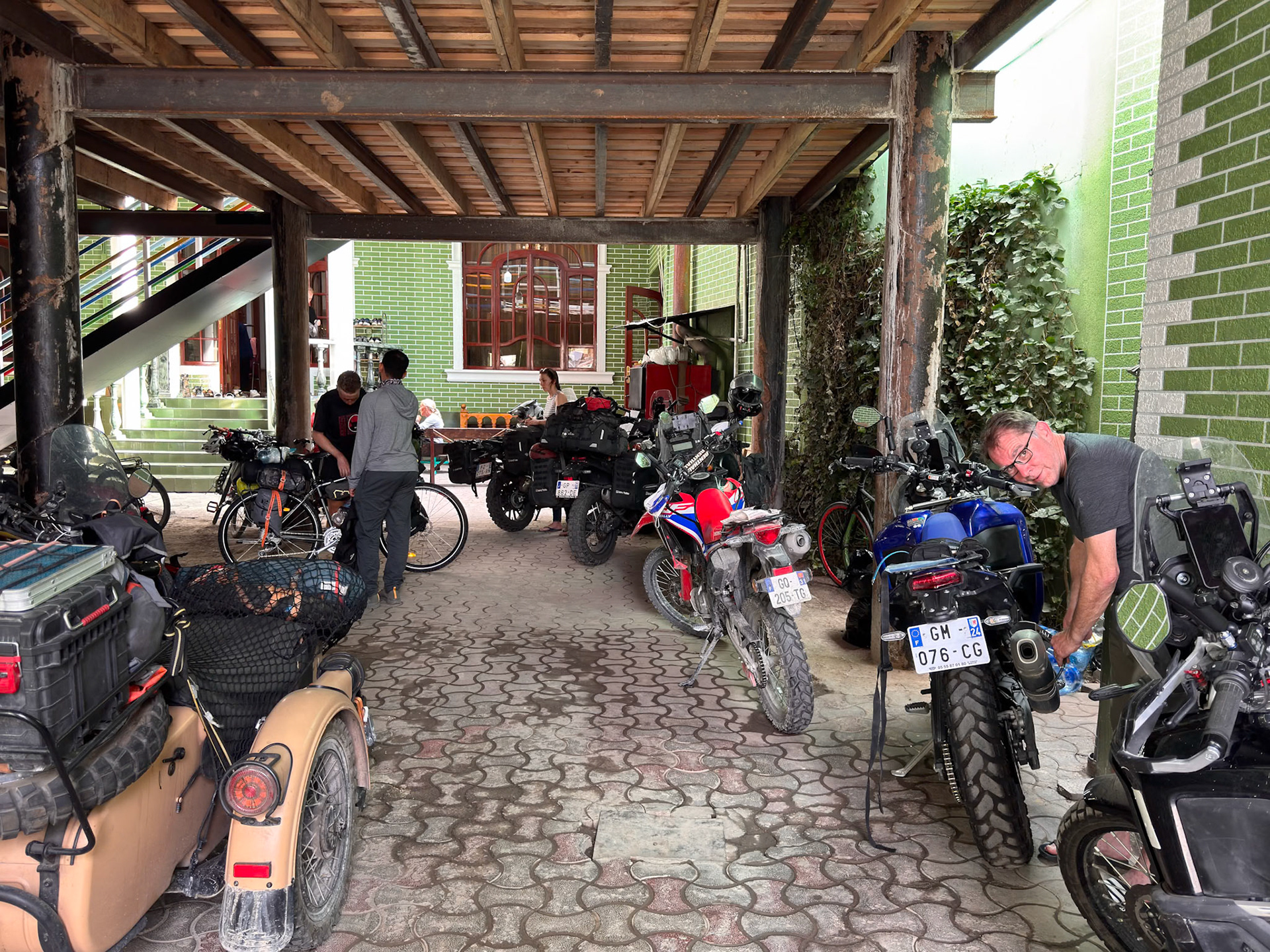 The Green House hostel has a nice vibe and plenty of interesting vehicles and travelers