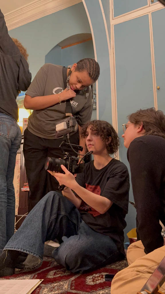 Gaffer (Left), DOP (middle) and Director (right) checking a shot