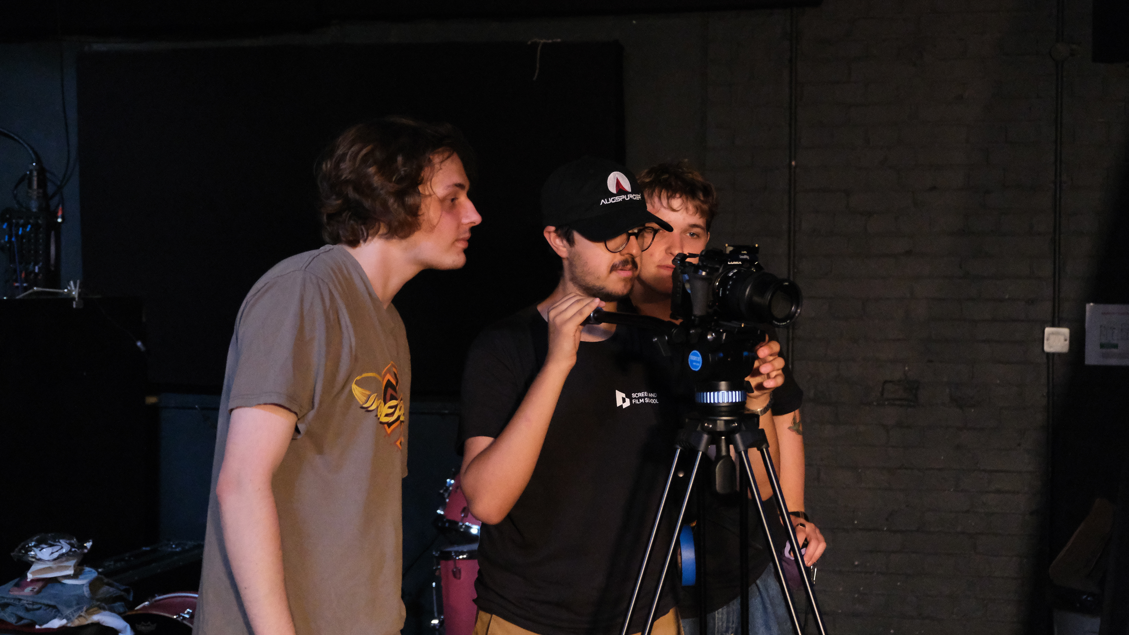 Director (middle) checking shot