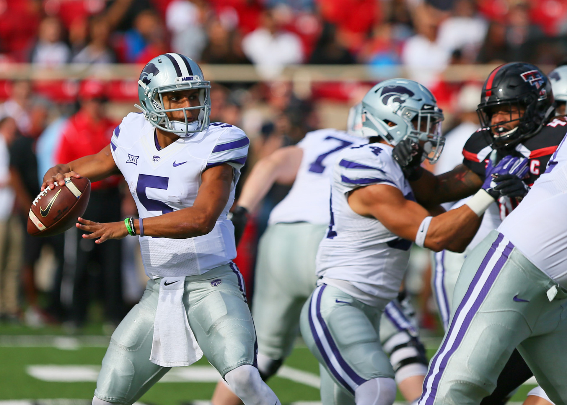 LUBBOCK, TX - NOVEMBER 04: Kansas State quarterback Alex Delton (5) drops back to pass during the Texas Tech Raider's 42-35 loss to the Kansas State Wildcats on November 4, 2017 at Jones AT&amp;T Stadium in Lubbock, TX. (Photo by Sam Grenadier/Icon Sportswire)