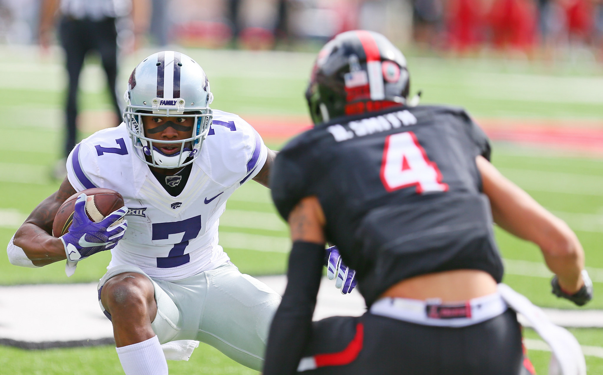 LUBBOCK, TX - NOVEMBER 04: Kansas State wide receiver Isaiah Zuber (7) attempts to shake Texas Tech defensive back Desmon Smith (4) during the Texas Tech Raider's 42-35 loss to the Kansas State Wildcats on November 4, 2017 at Jones AT&amp;T Stadium in Lubbock, TX. (Photo by Sam Grenadier/Icon Sportswire)