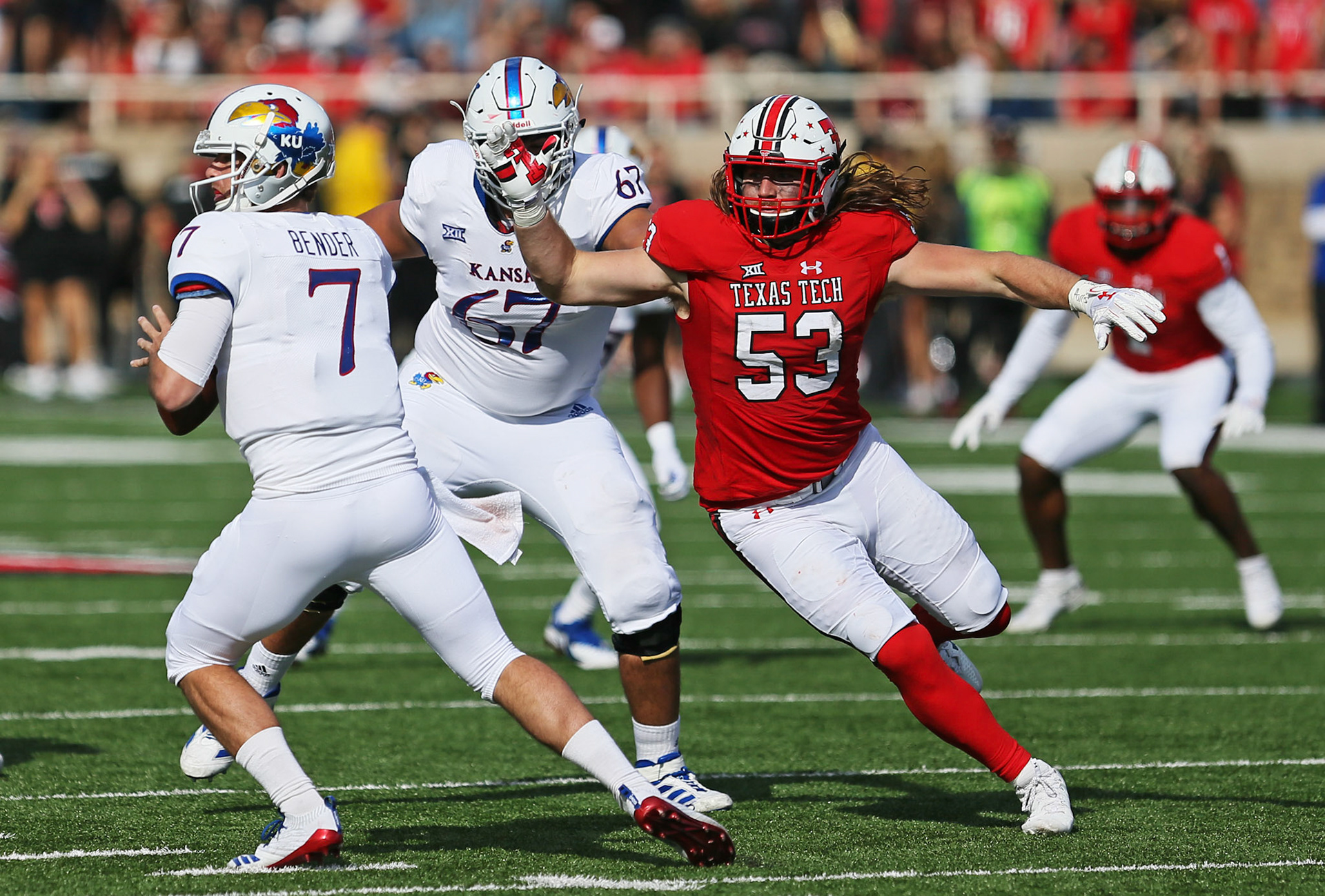 Texas Tech's Eli Howard (53) pressures Kansas quarterback Peyton Bender (7) during game against Kansas Saturday, Oct. 20, 2018, at Jones AT&amp;T Stadium in Lubbock, Texas. [Sam Grenadier/A-J Media]