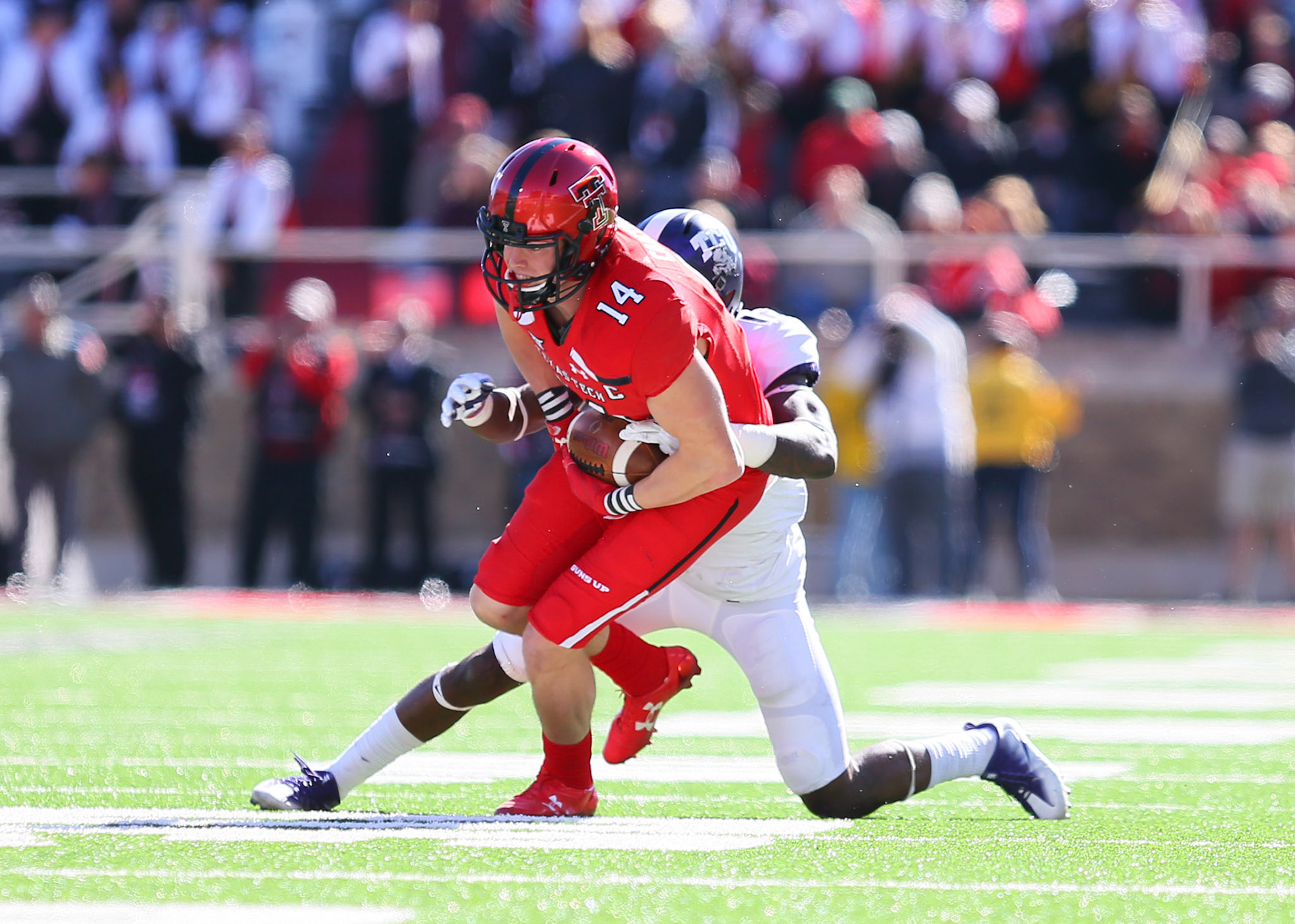 LUBBOCK, TX - NOVEMBER 18: Texas Tech wide receiver Dylan Cantrell (14) is tackled during the Texas Tech Raider's 27-3 loss to the Texas Christian University Horned Frogs on November 18, 2017 at Jones AT&amp;T Stadium in Lubbock, TX. (Photo by Sam Grenadier/Icon Sportswire)