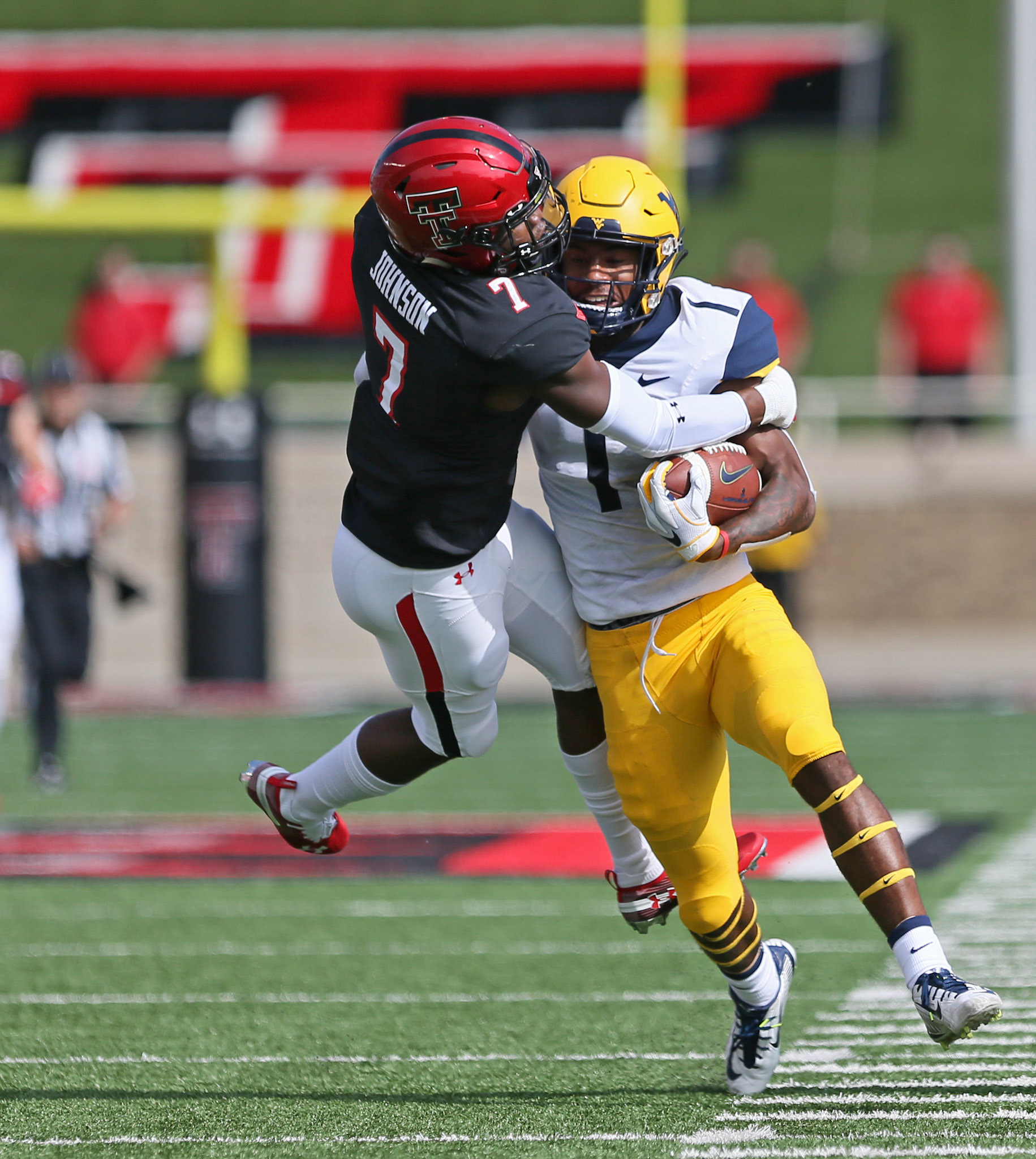 Texas Tech's Jah'Shawn Johnson (7) Tackles West Virginia's T.J. Simmons during game against West Virginia Saturday, Sept. 29, 2018, at Jones AT&amp;T Stadium in Lubbock, Texas. [Sam Grenadier/A-J Media]