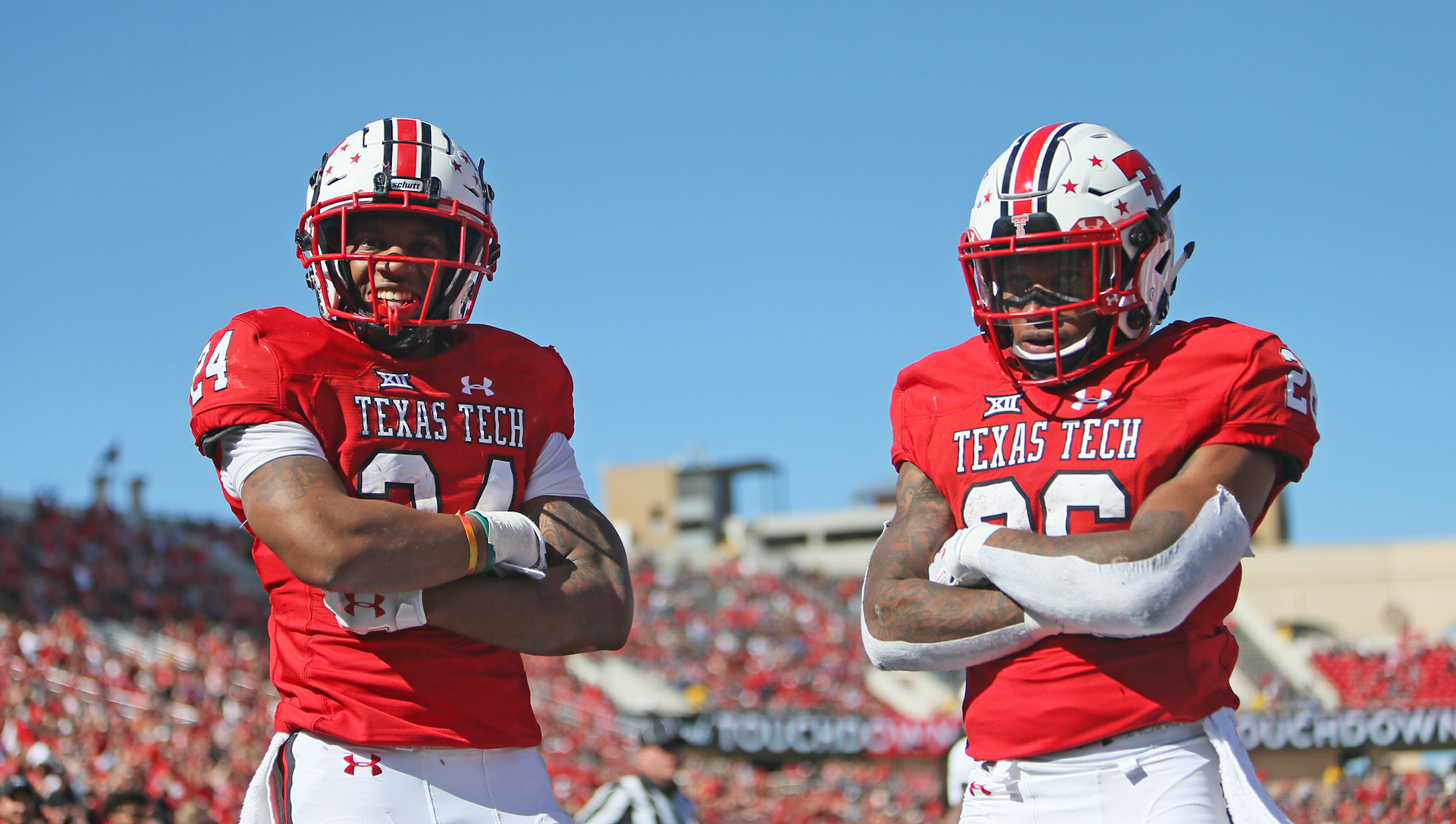 Texas Tech's Tre King (24) and Ta'Zhawn Henry (26) celebrate a touchdown during game against Kansas Saturday, Oct. 20, 2018, at Jones AT&amp;T Stadium in Lubbock, Texas. [Sam Grenadier/A-J Media]