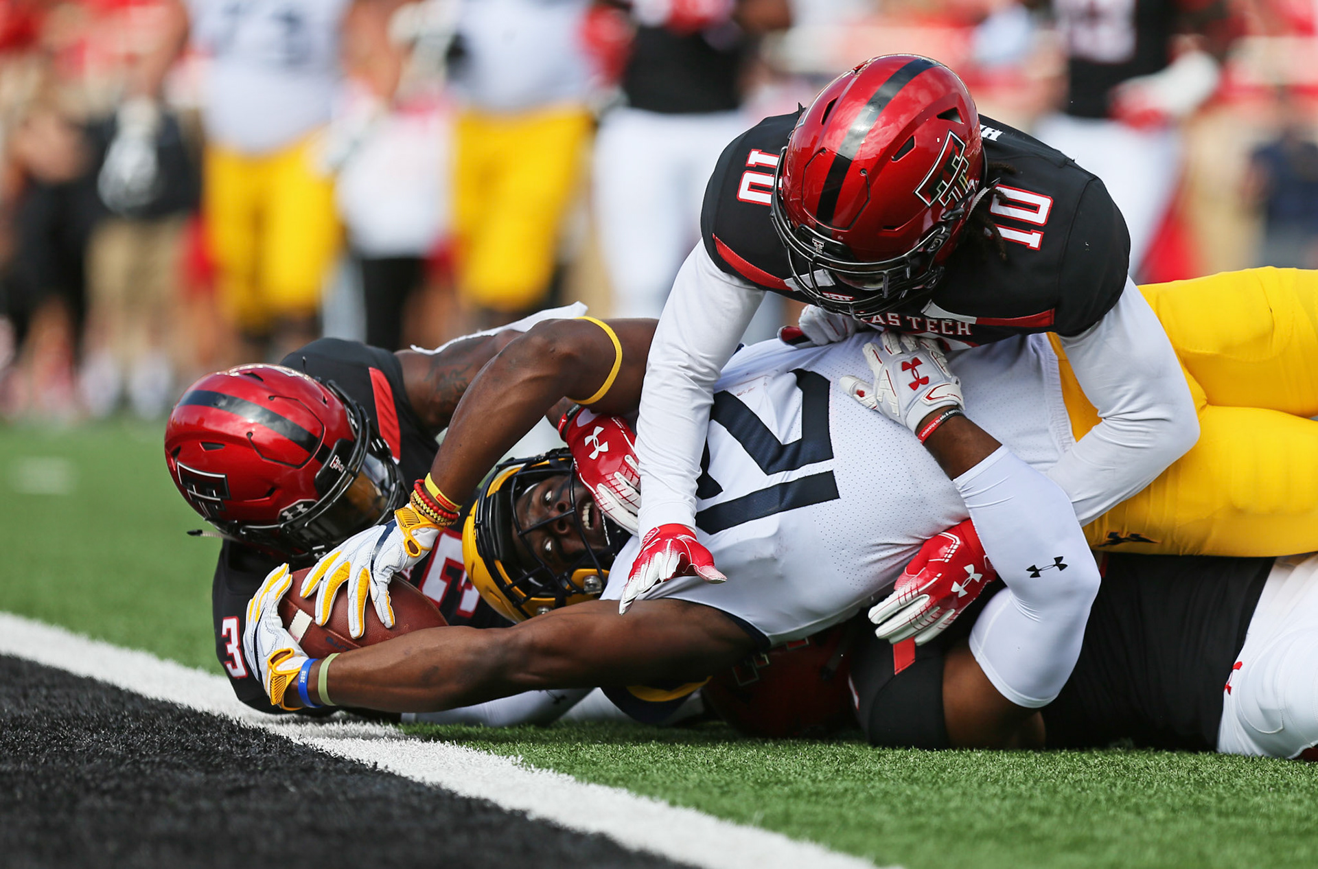 West Virginia's Gary Jennings Jr. (12) is stopped just short of the goal line during game against West Virginia Saturday, Sept. 29, 2018, at Jones AT&amp;T Stadium in Lubbock, Texas. [Sam Grenadier/A-J Media]