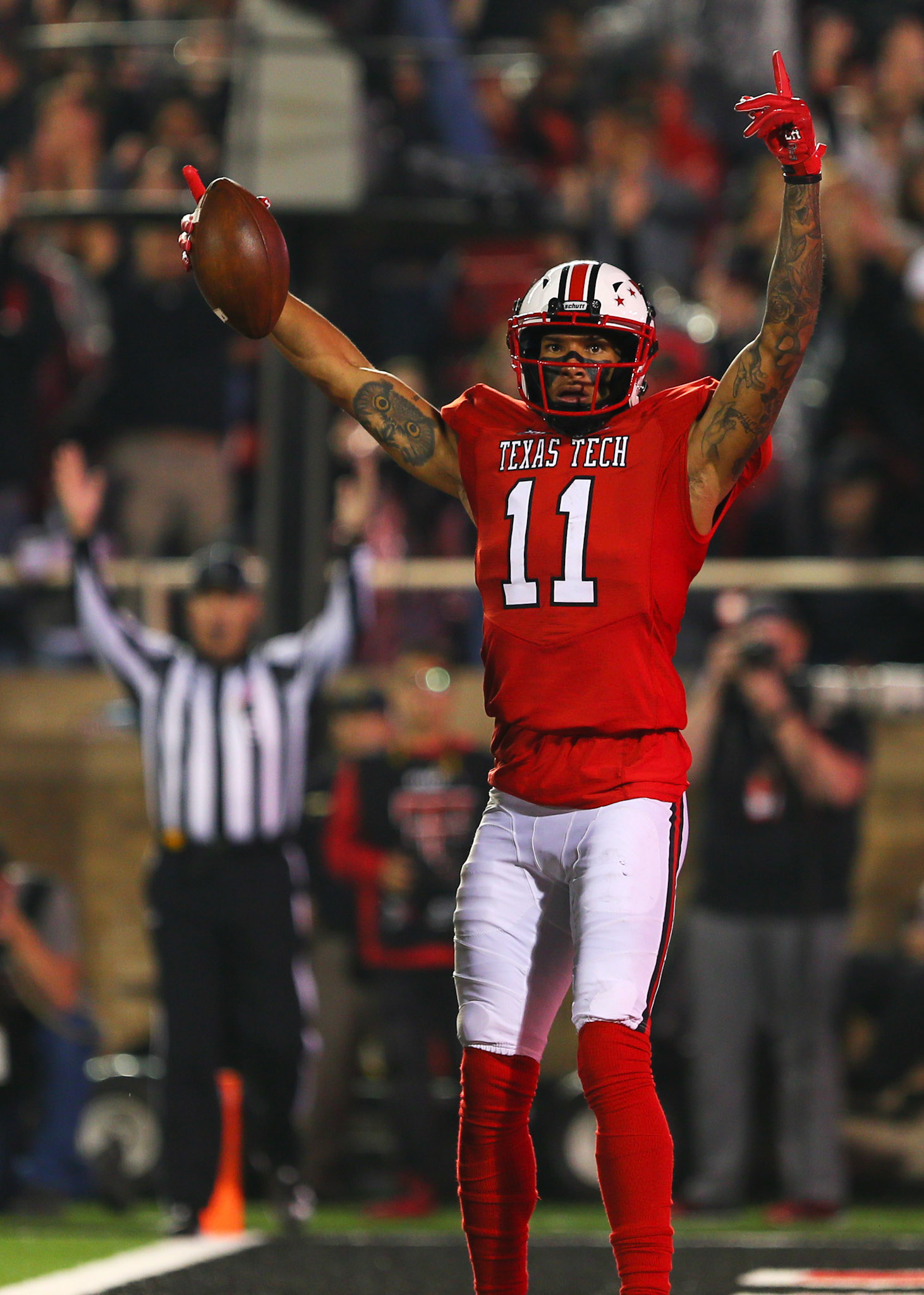 LUBBOCK, TX - SEPTEMBER 30: Texas Tech wide receiver Derrick Willies (11) celebrates a touchdown during the Texas Tech Raider's 41-34 loss to the Oklahoma State Cowboys on September 30, 2017 at Jones AT&amp;T Stadium in Lubbock, TX. (Photo by Sam Grenadier/Icon Sportswire)