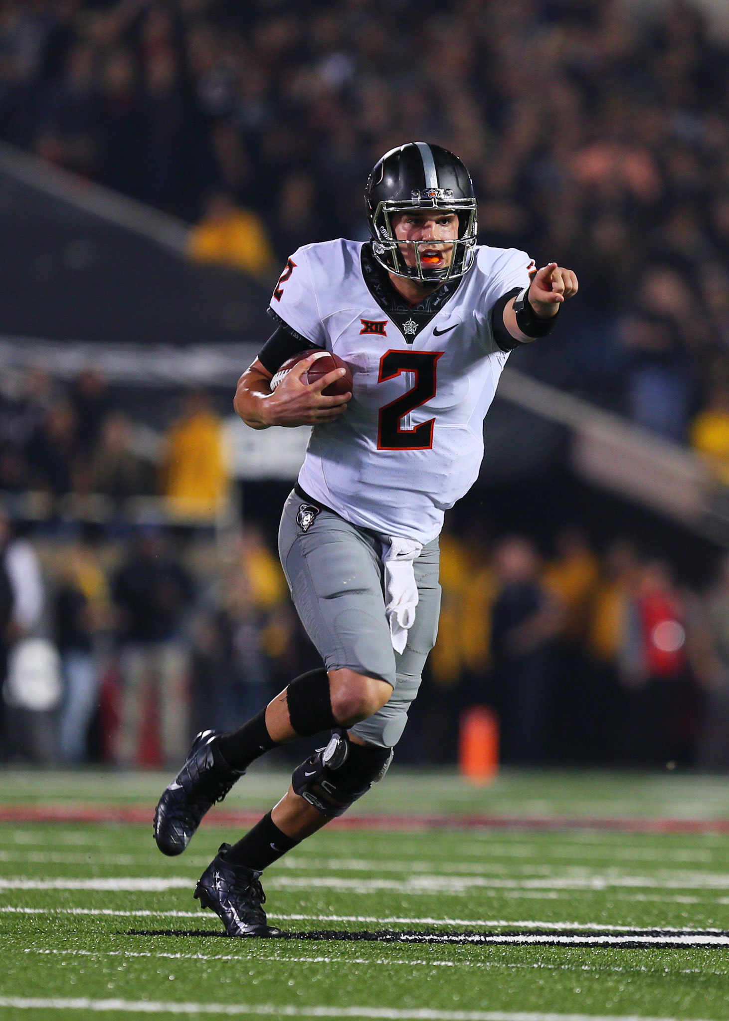 LUBBOCK, TX - SEPTEMBER 30: Oklahoma State quarterback Mason Rudolph (2) runs with the ball during the Texas Tech Raider's 41-34 loss to the Oklahoma State Cowboys on September 30, 2017 at Jones AT&amp;T Stadium in Lubbock, TX. (Photo by Sam Grenadier/Icon Sportswire)